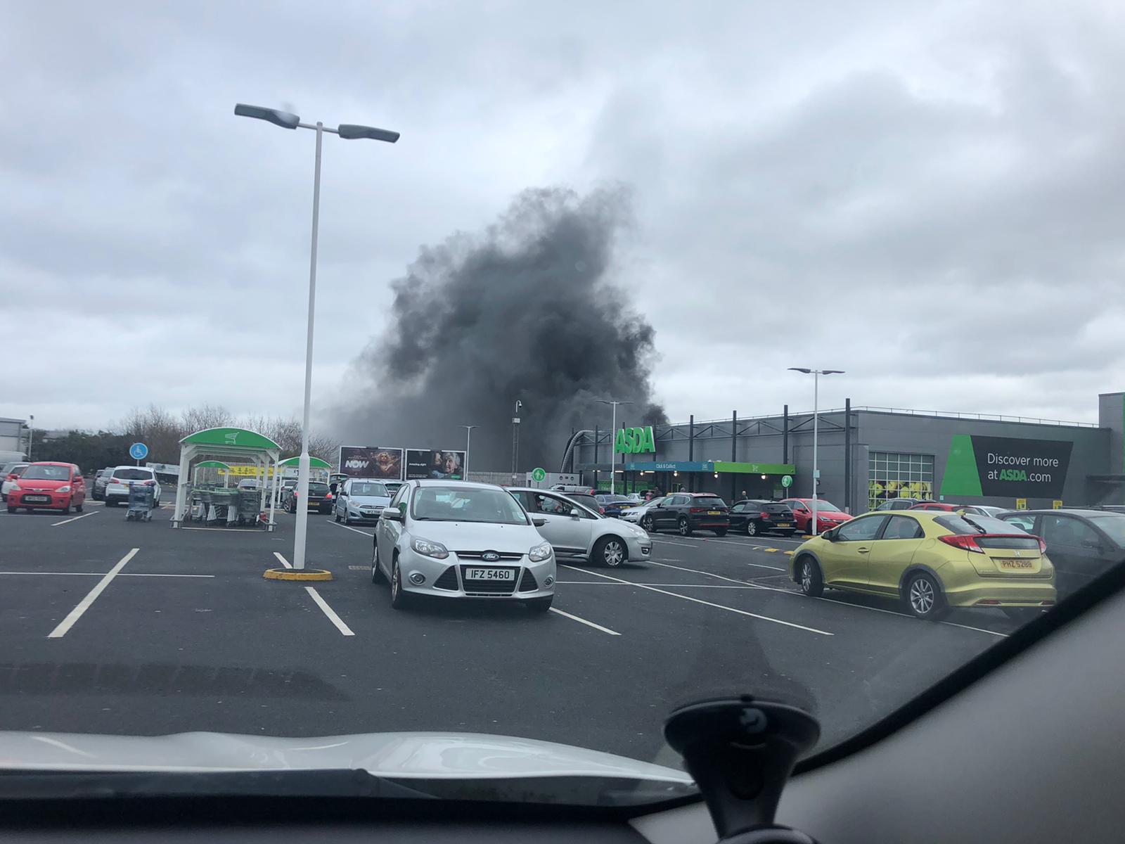 DELIBERATE: Smoke envelopes the car park of Asda supermarket 