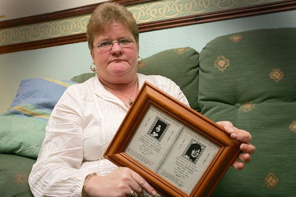 APPEAL: Margaret Kennedy holds a framed memorial of her mother Maura Meehan and aunt Dorothy Maguire. 