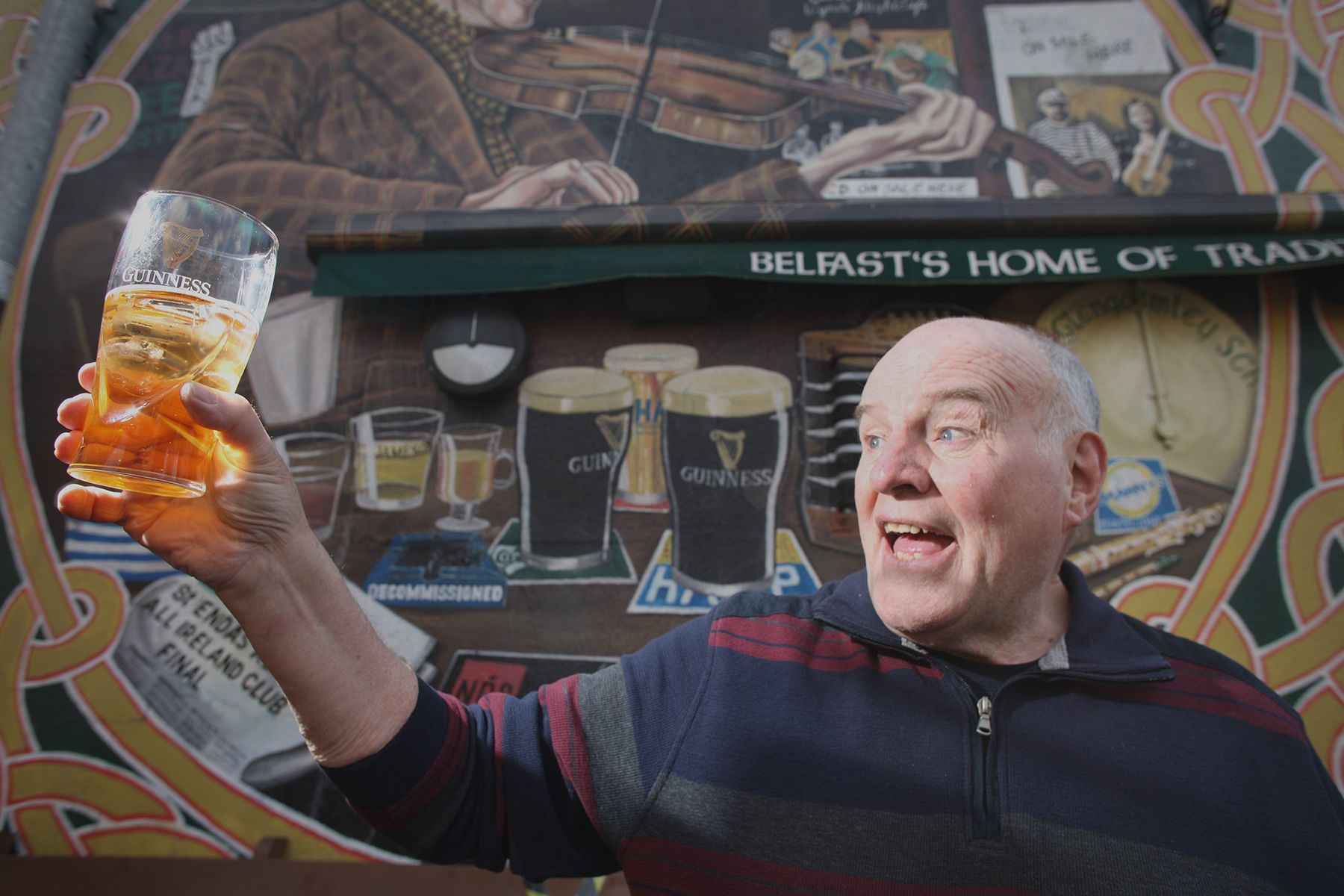 RAISING A GLASS TO LOCKDOWN EASING: Brian McMullan snr. checks the clarity of the pints as Madden\'s Bar in the city centre gets ready to open its door for outdoors trading from Friday. 