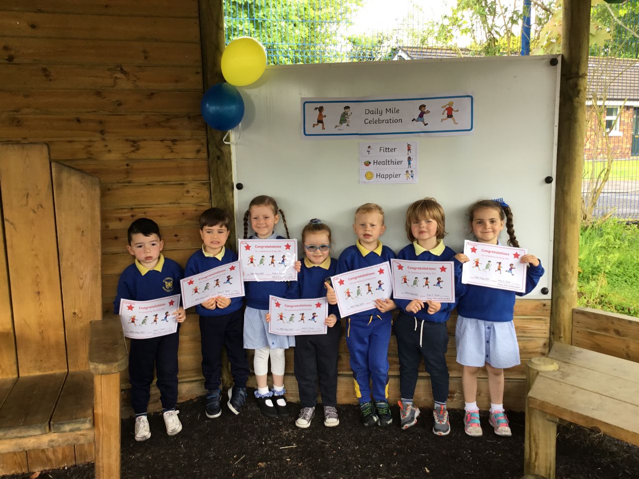 CHALLENGE: Children from St Teresa\'s Nursery School with their daily mile challenge certificates