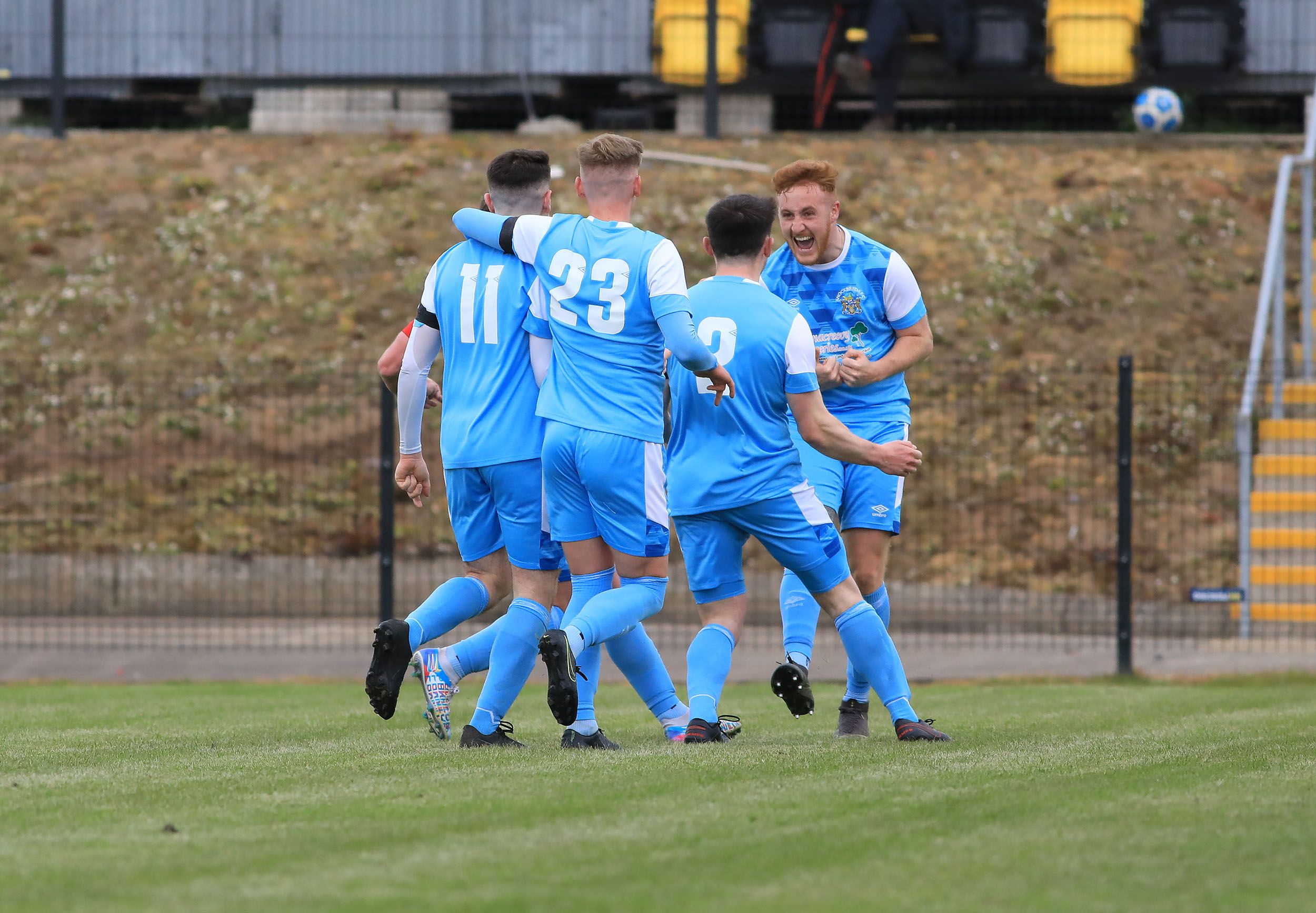Knockbreda\'s Cillin Gilmore celebrates with his teammates after putting his side 2-1 ahead during Saturday\'s Irish Cup victory over Newington at Breda Park 