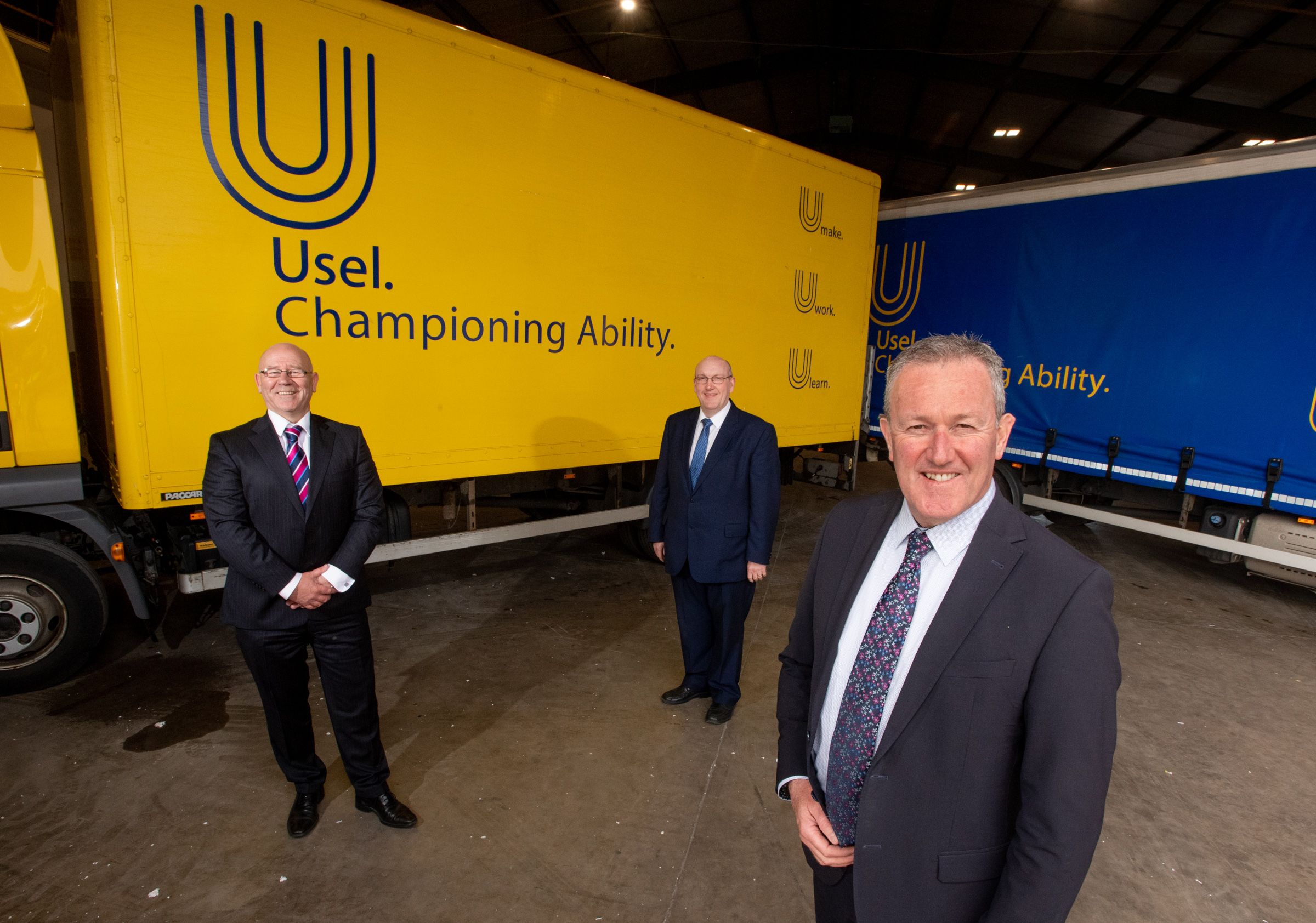 CHAMPIONING ABILITY: Finance Minister Conor Murphy with Usel Chief Executive Bill Atkinson, and Chair William Leathem.
