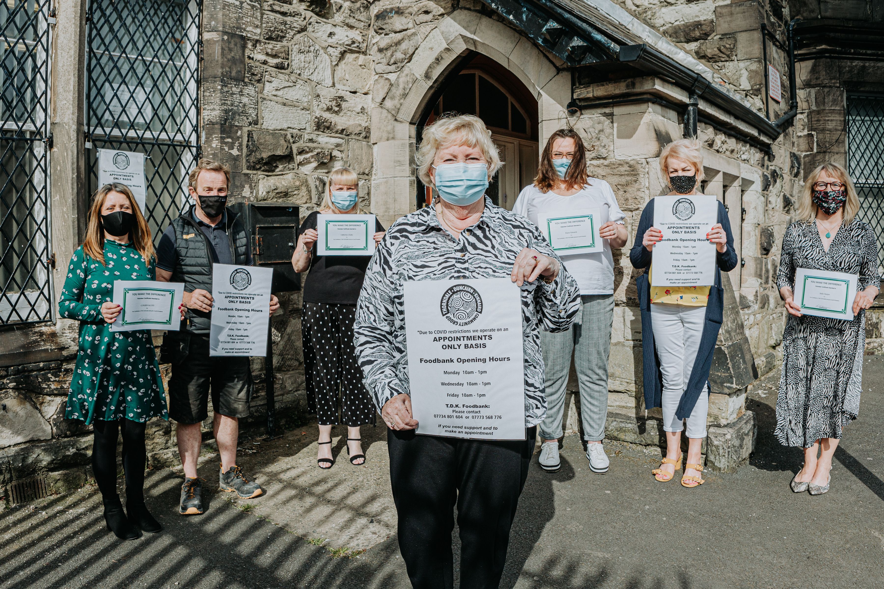VOLUNTEERS: Rosemary McGreevy from TDK Community Group with volunteers at their foodbank, run from the 174 Trust at the Duncairn Centre (Photo Credit: Melissa Gordon, Gorgeous Photography)