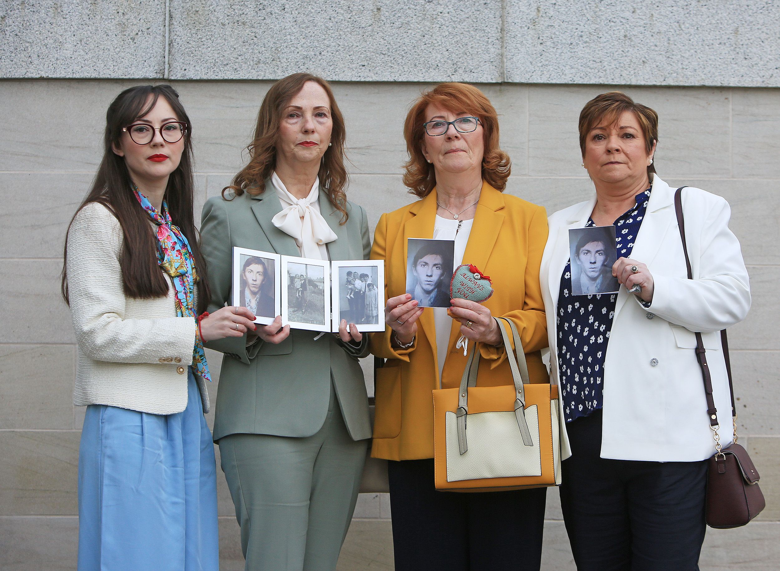 INNOCENT: Families of those killed in the Ballymurphy Massacre gathered outside the court with photos of their loved ones. 