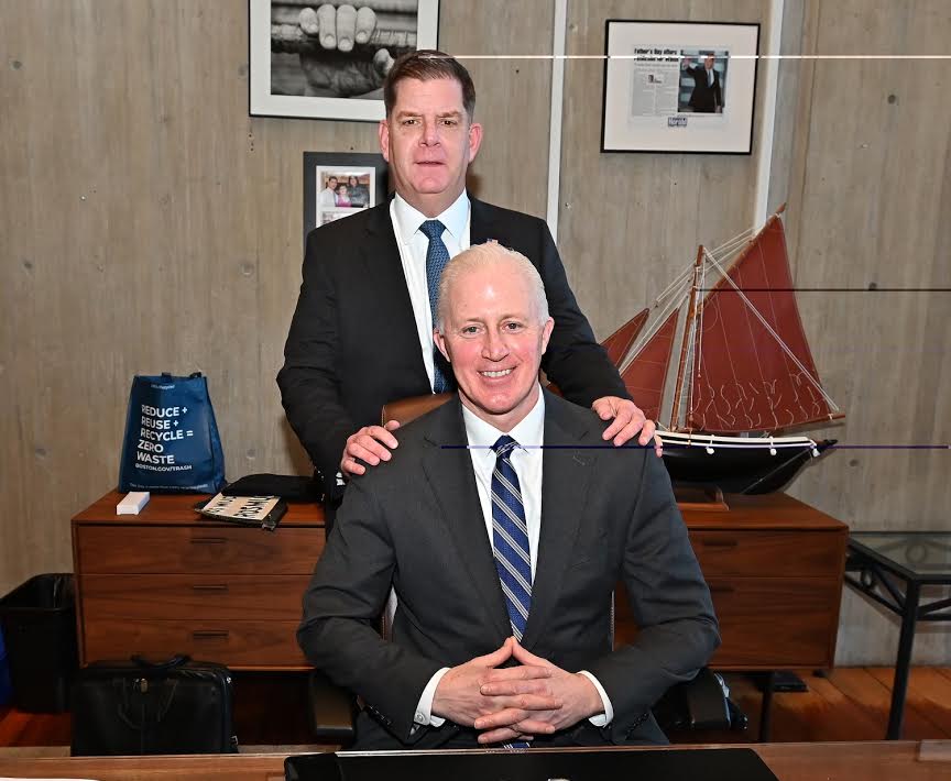 Newly minted U.S. Secretary of Labor Martin \"Marty\" Walsh (standing) and his longtime friend and political ally, Eugene \"Gene\" O\'Flaherty, in their last picture together in the mayoral office.