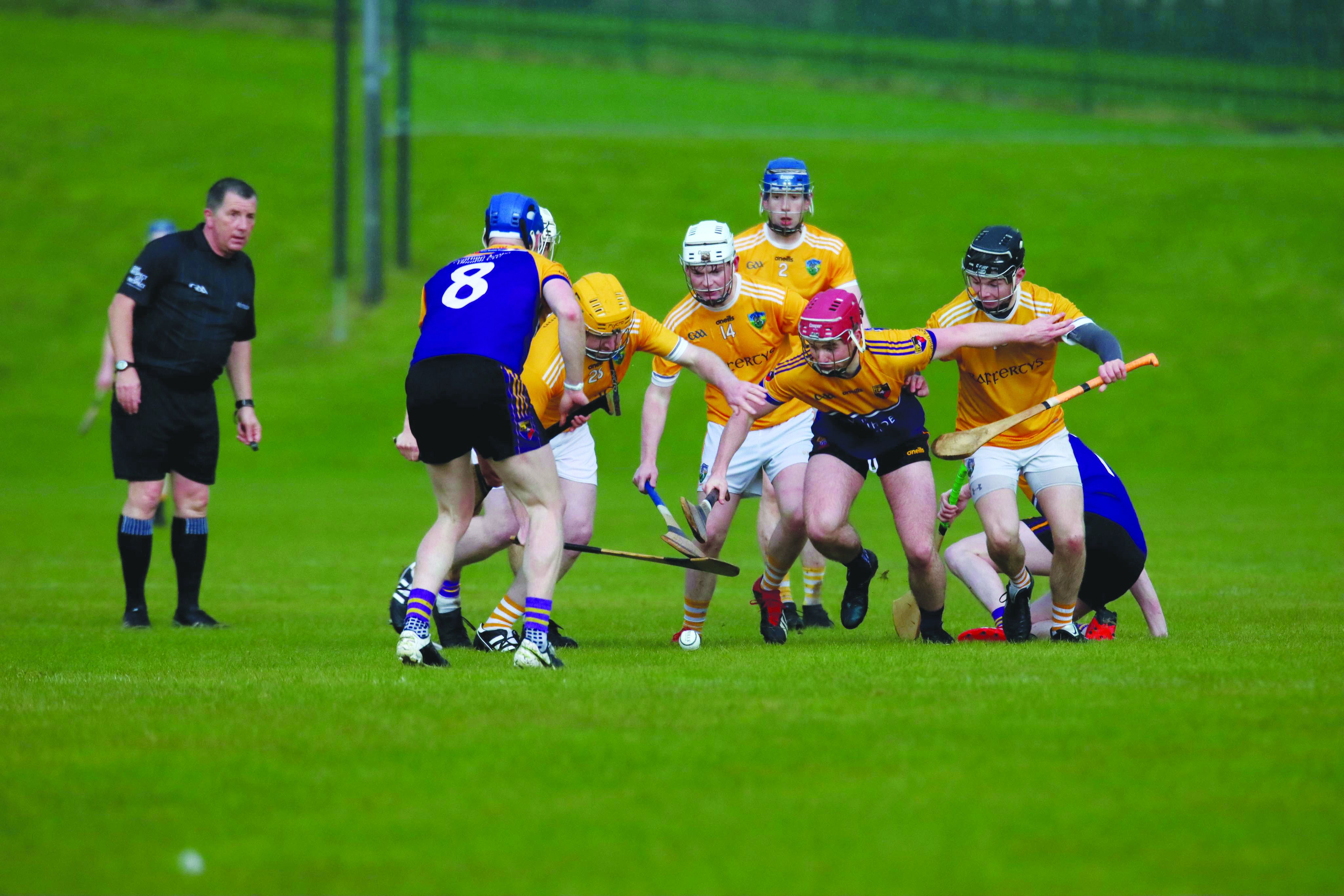 Carryduff\'s Donal Rooney battles for possession against Tony Duffy of Cuchulainns 