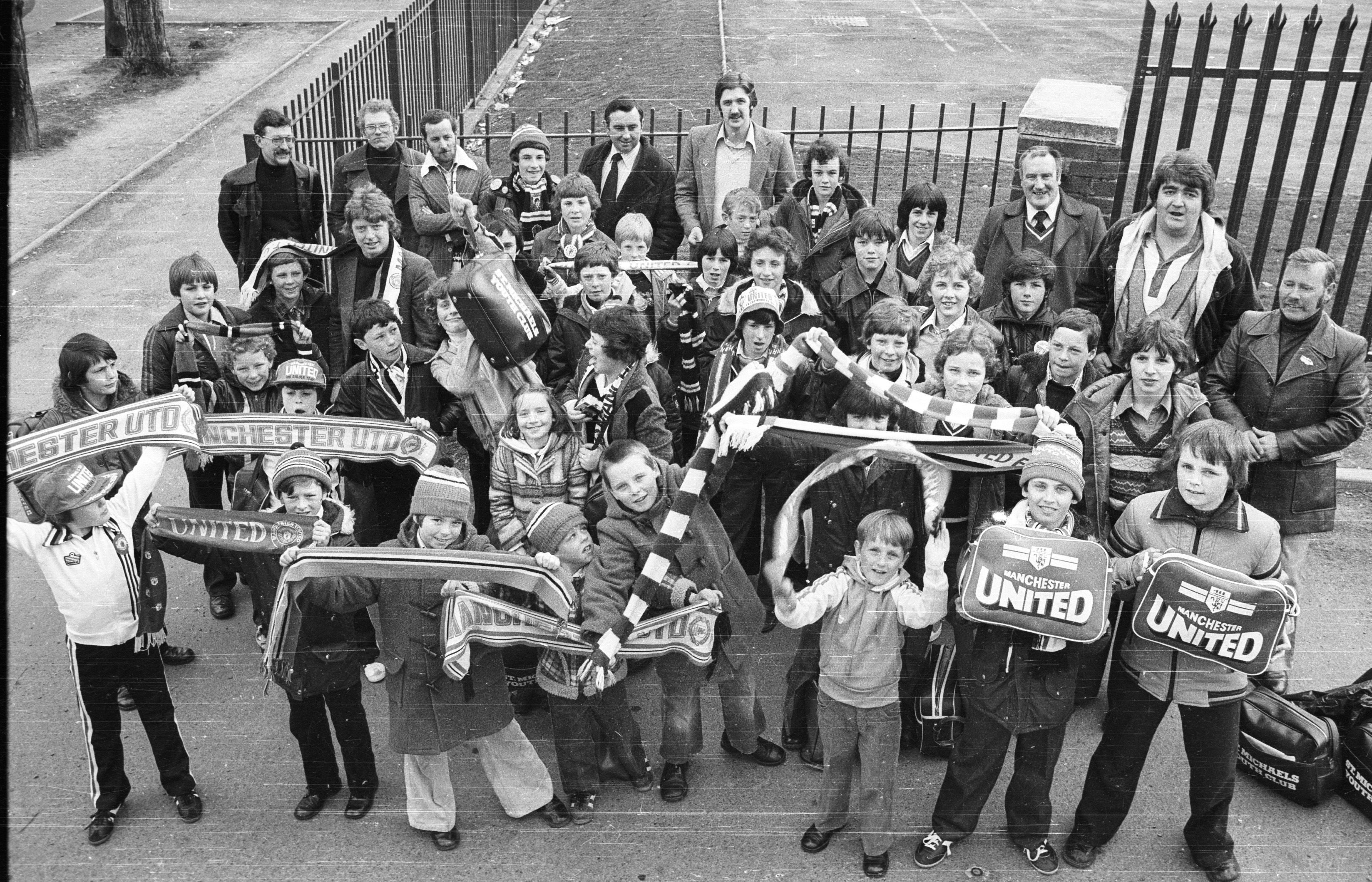 RED DEVILS: Youth leaders Pat Butler and Eddie Neeson lead a St Michael’s Youth Club trip to Manchester to watch Man United play Derby County back in May 1979