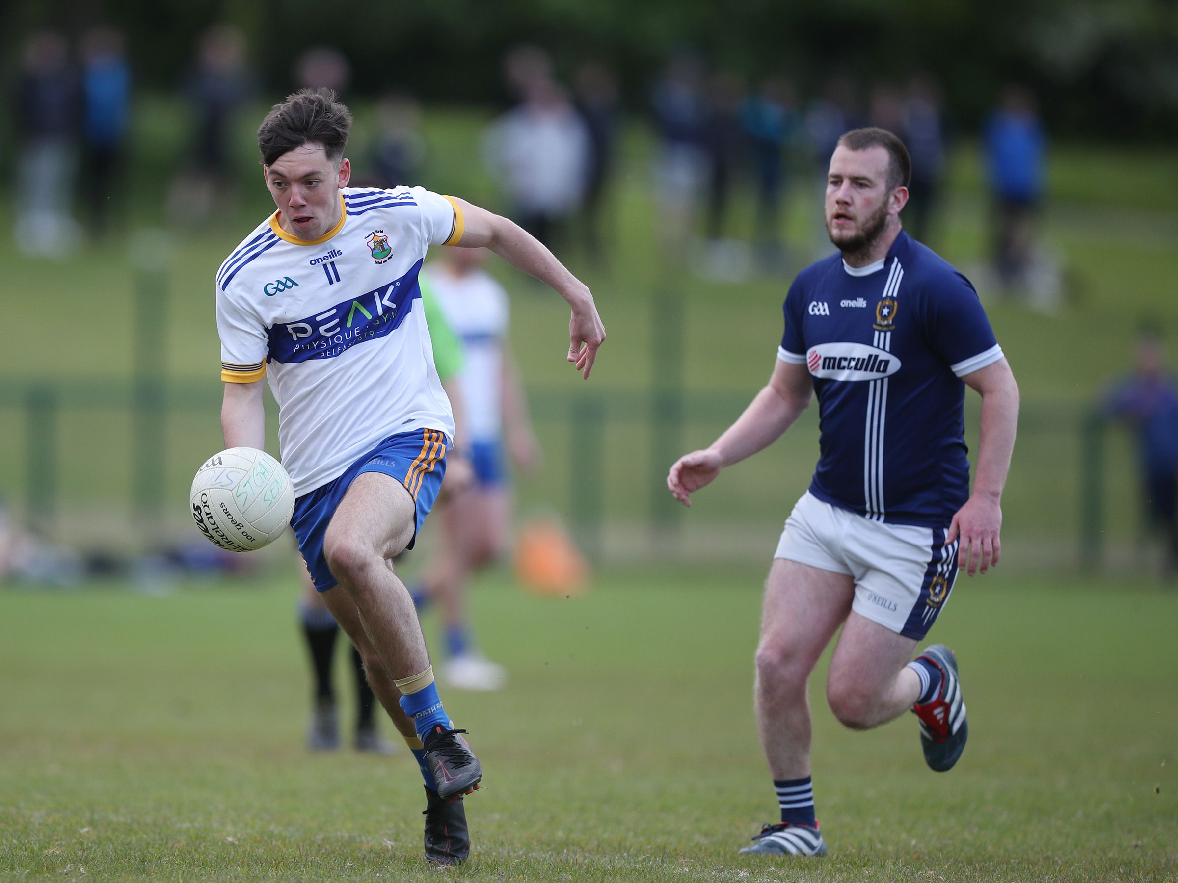 Ryan Tweedy bursts past Ruairi Wilson at Musgrave Park on Wednesday
