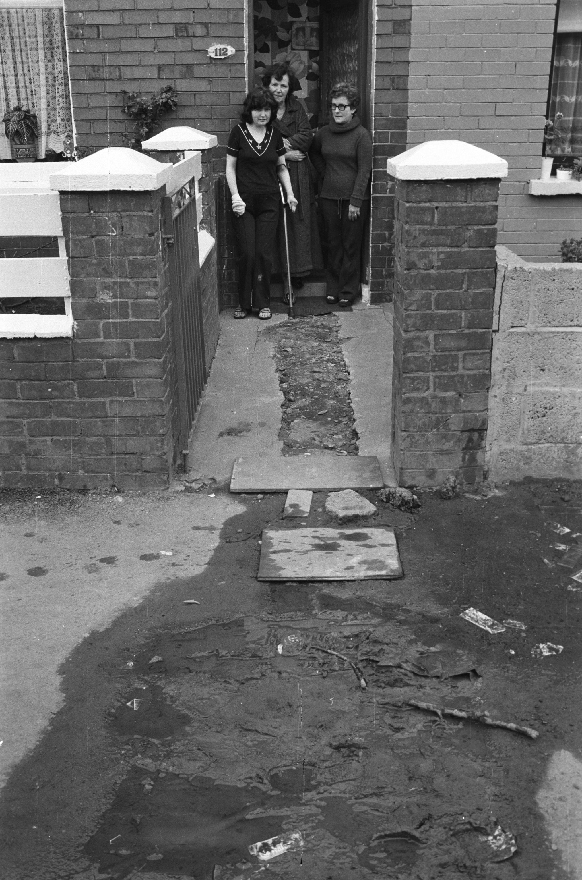 CONCRETE PROOF: Mrs Heaney, Mrs O\'Prey and Mrs McAleese are dismayed at DoE street repairs in St James\' Road