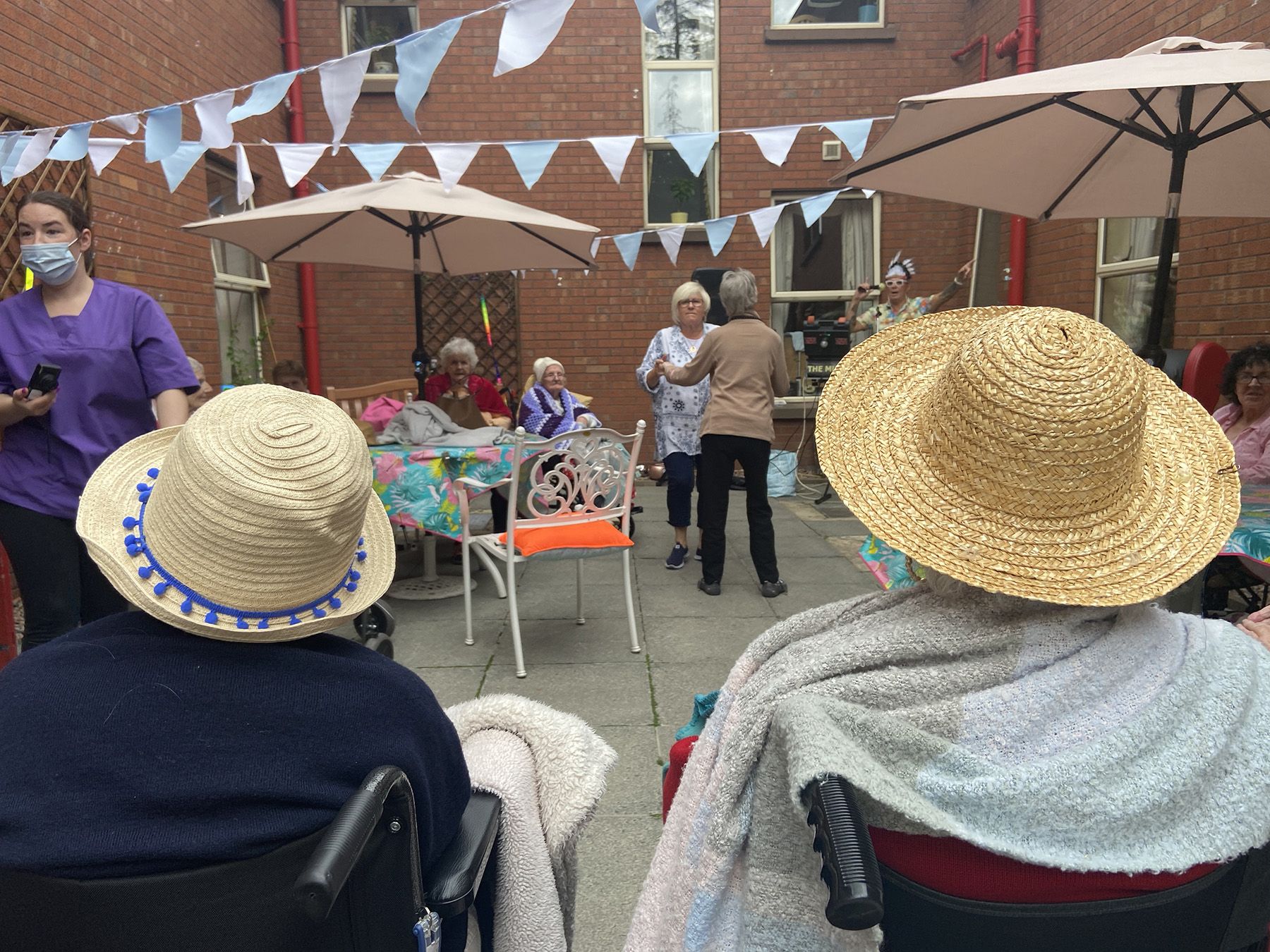 FRUITHILL CARE HOME RESIDENTS ENJOYING A GARDEN PARTY: Government will press for all care home staff to be fully vaccinated. 