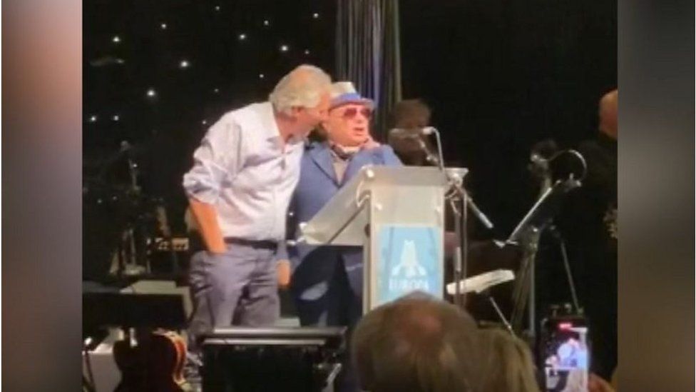 ALL TOGETHER NOW: An East Belfast singer and a North Antrim fan
