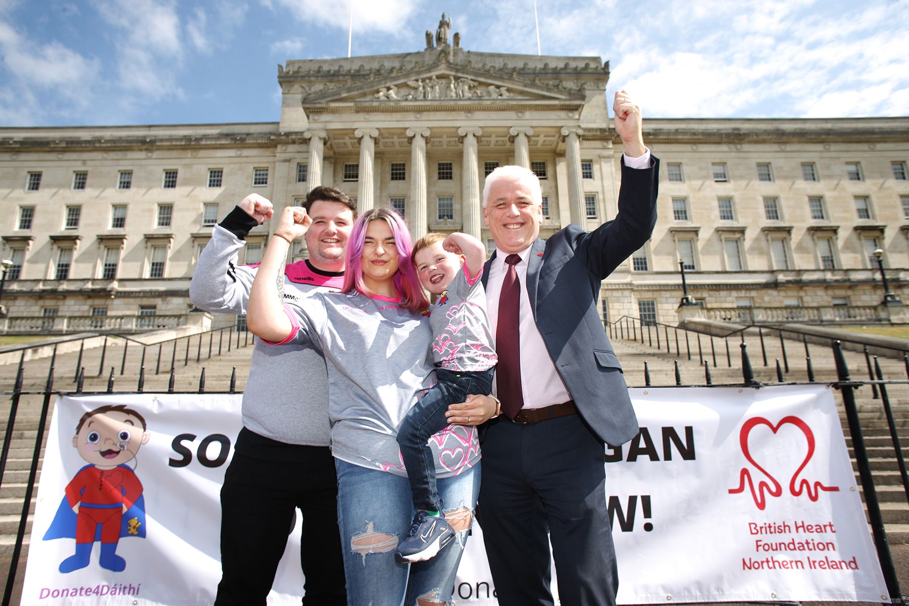 TOGETHER: Dáirthí with mum Seph, dad Máirtín and Head of the British Heart Foundation NI, Ferghal McKinney