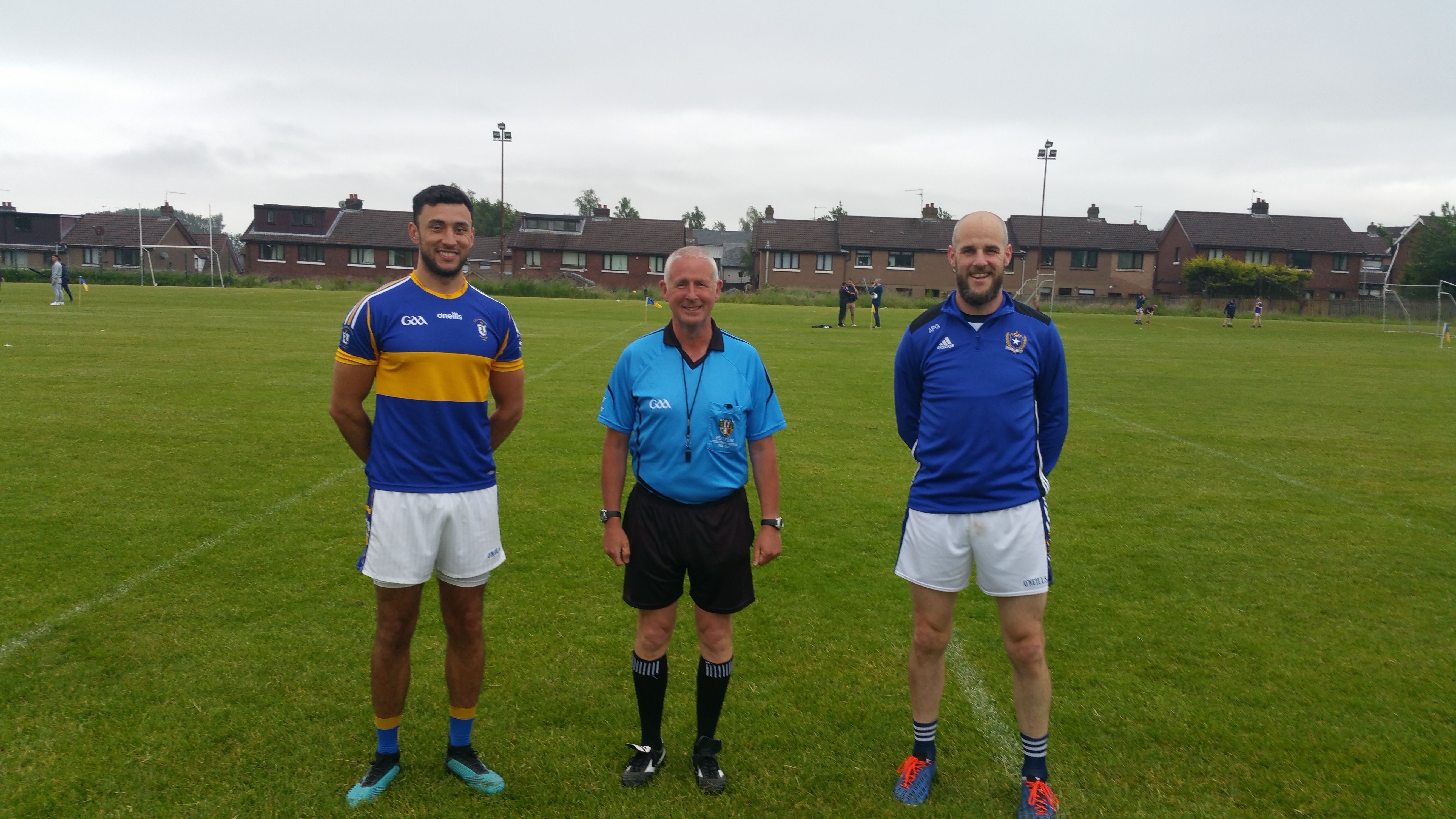 Team captains, Com Fleming (Rossa) and Aodhan Gallagher (St Gall\'s) with referee, Brendan Toland