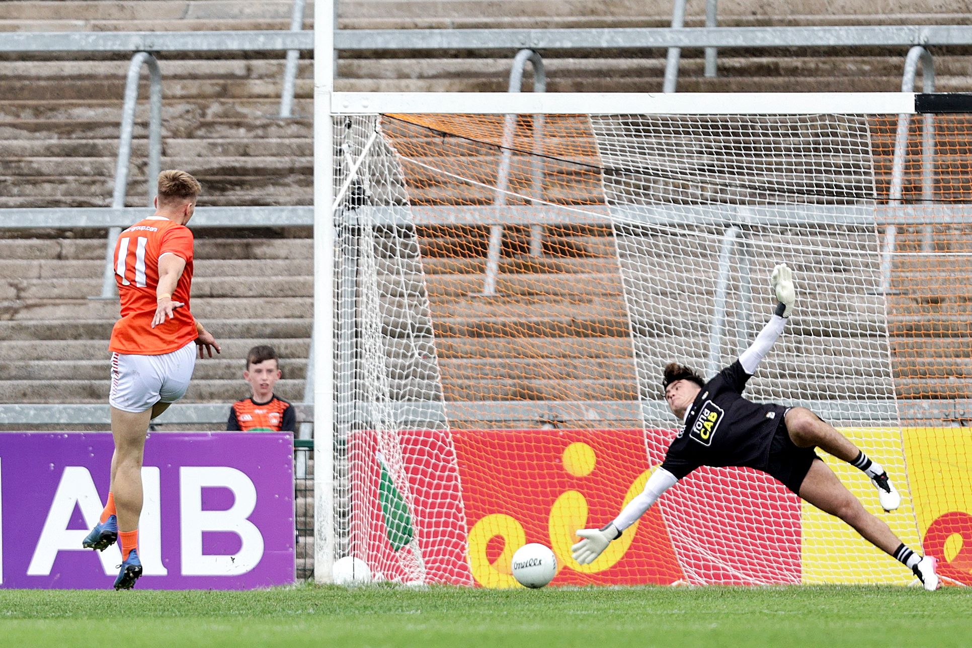 Armagh\'s Rian O\'Neill converts a second half penalty past Antrim goalkeeper Luke Mulholland as the Orchard County booked their place in the Ulster SFC semi-final with a 13-point victory in the Athletic Grounds 