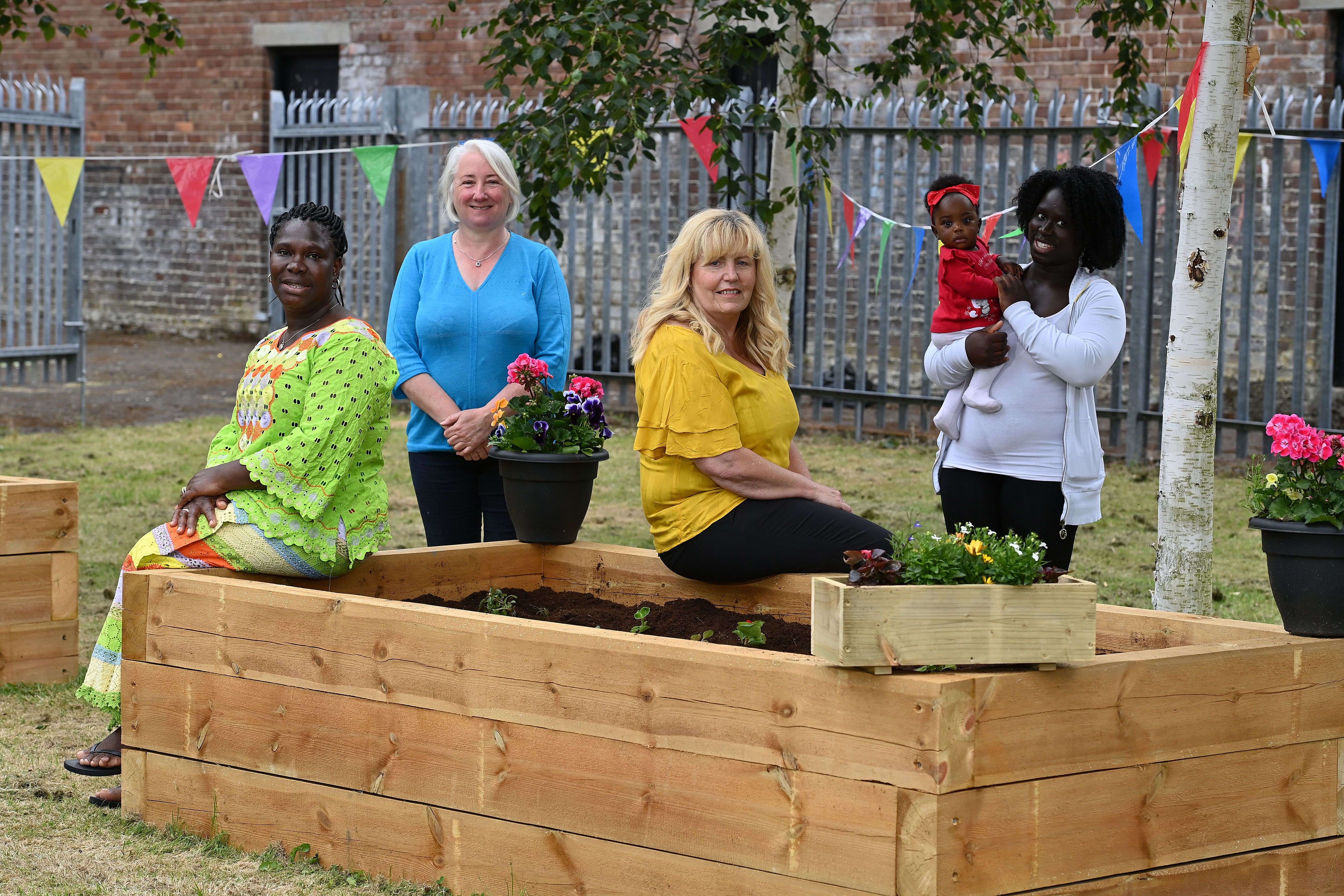 TRANSFORMATION: Maria Semoda, Janice Beggs (LOCA Centre Manager), Fiona McAuley (Radius Housing) and Tianna and Daisy da Silva