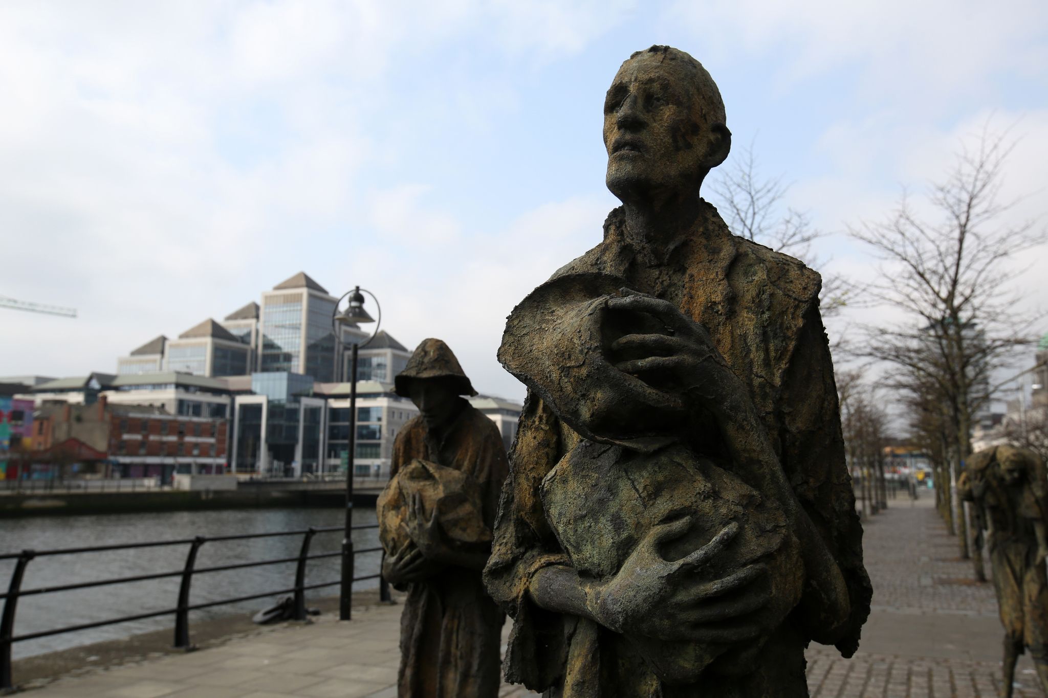 HEROES OF THE HORROR: Great Hunger victims await the coffins ships to America as depicted by sculptor Rowan Gillespie at Dublin port. 