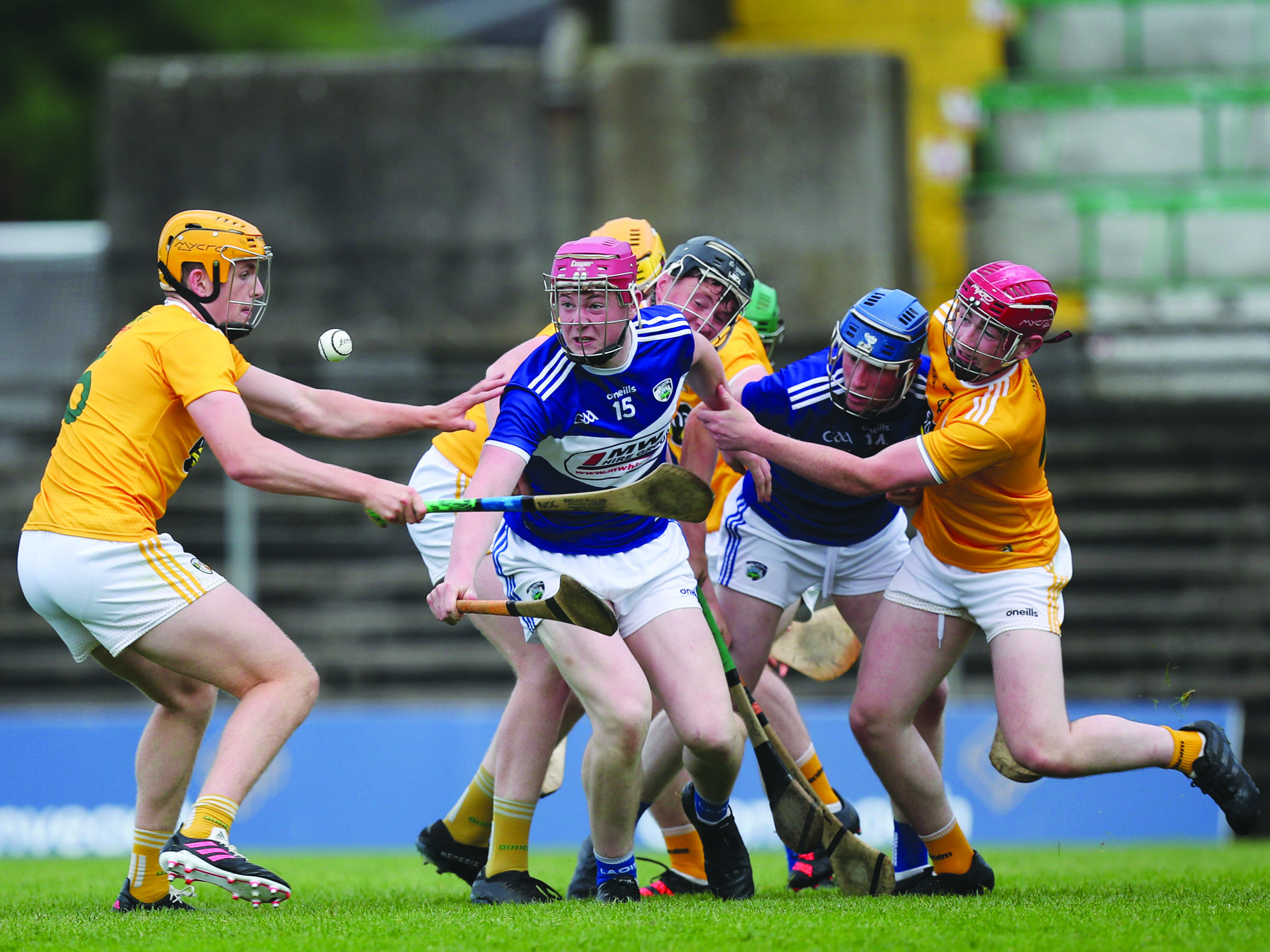 Antrim’s Niall O’Connor and Laois attacker Cathal Murphy emerge from a ruck of players to challenge for possession 