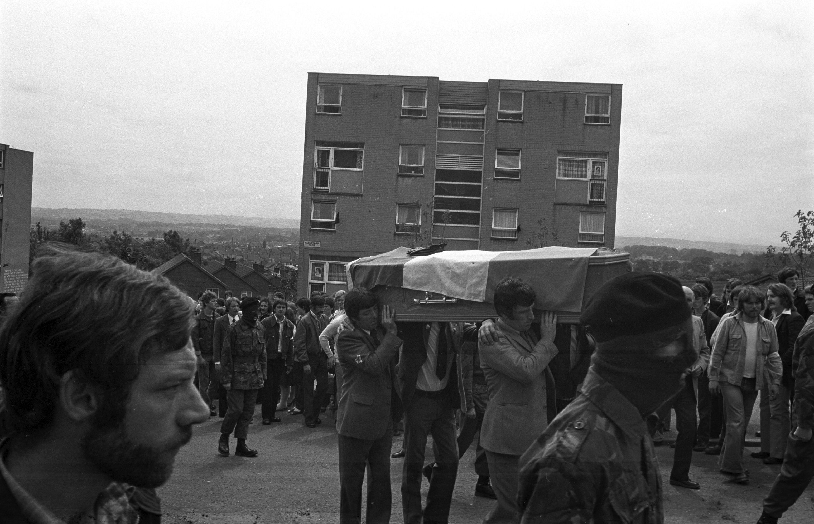 FINAL JOURNEY: Joe McDonnell\'s coffin is carried up Lenadoon Avenue onto Glenveagh Drive on its way to St Oliver Plunkett Church in Lenadoon