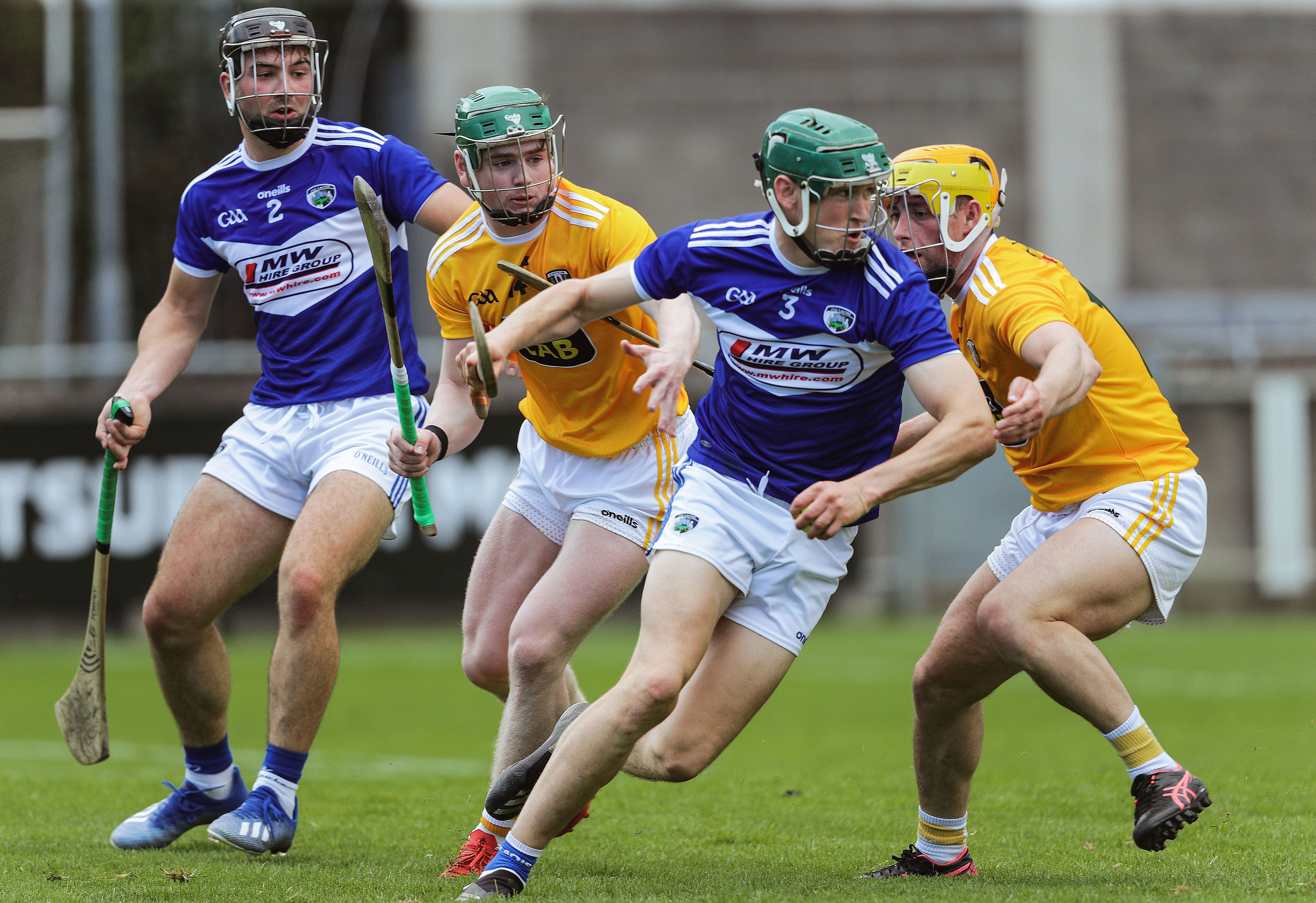 Seán Downey bursts clear of Conal Cunning and Conor Johnston