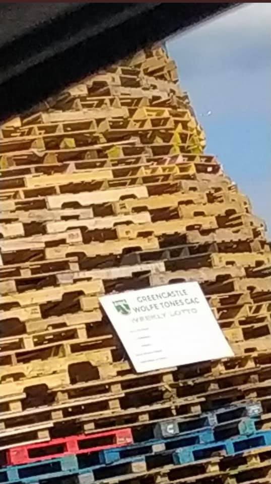 DISGRACEFUL: The lotto board of Greencastle Wolfe Tones GAA club appeared on a loyalist bonfire