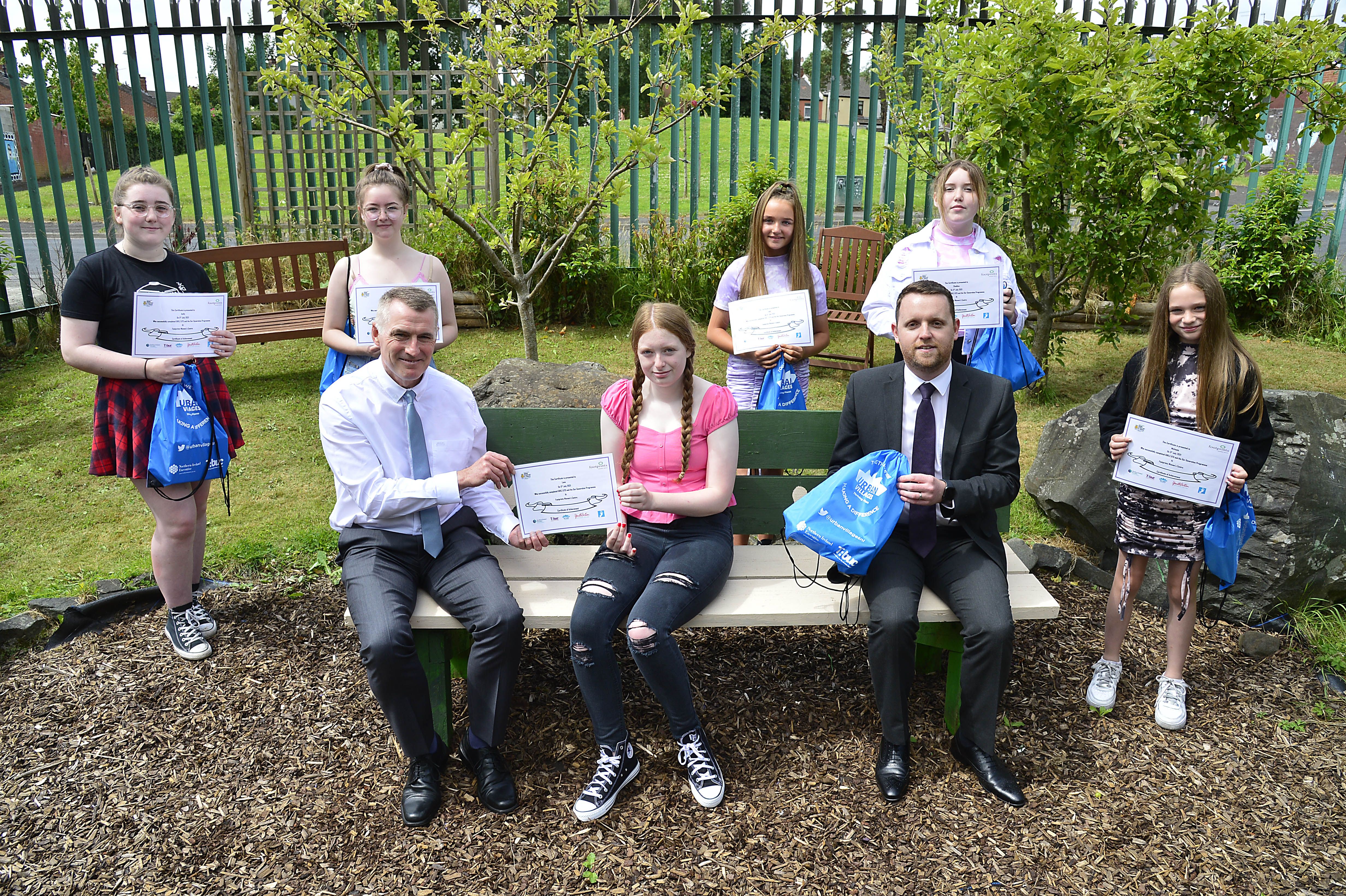 YOUTH ACTION: Junior Minister Declan Kearney and Junior Minister Gary Middleton congratulate girls who completed the OUR Generation/Girlz Utd programme at Footprints Women’s Centre in the Colin Urban Village area in West Belfast