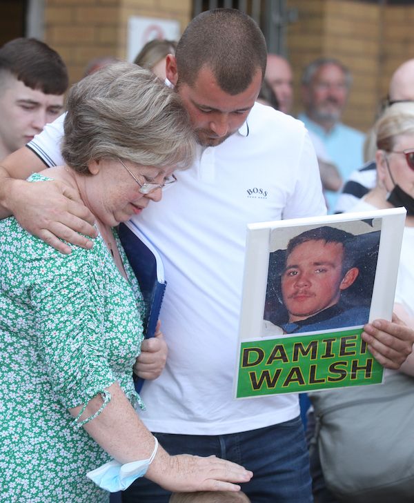 SOLACE: Damien Walsh\'s mother Marian is comforted at the Dairy Farm rally