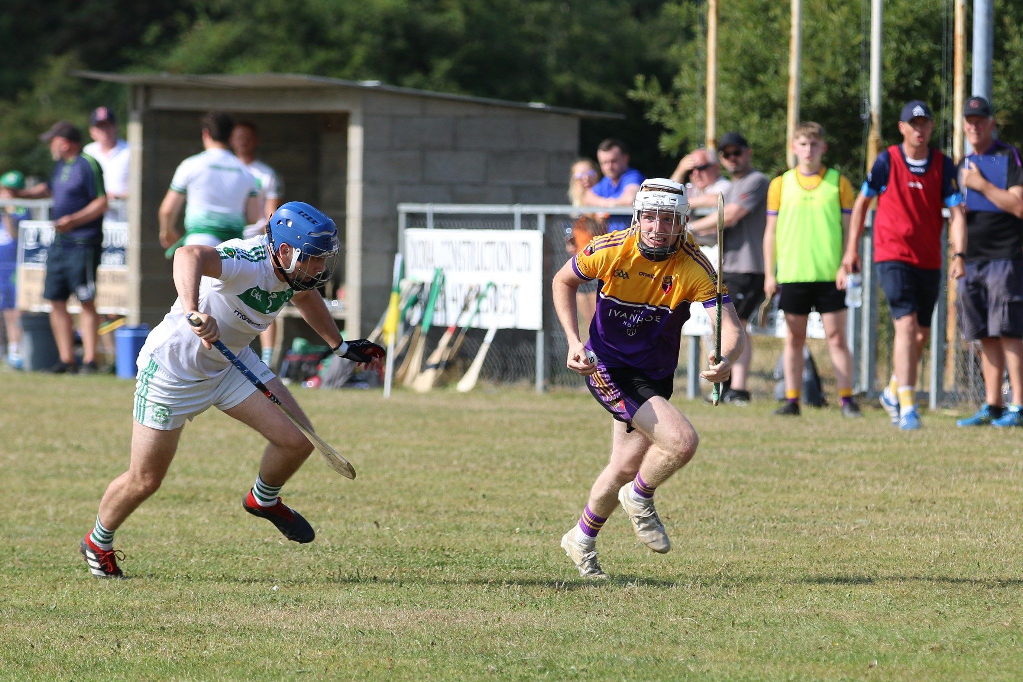 Carryduff\'s Eoin Rooney tries to get past Newry Shamrocks defender Matthew Mee during Sunday\'s Down IHC semi-final at Ballela 