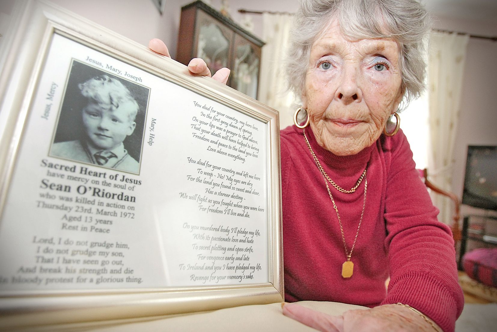 REMEMBERED: Flo O’Riordan holding a photo of her son Sean. Flo passed away peacefully at home on Saturday