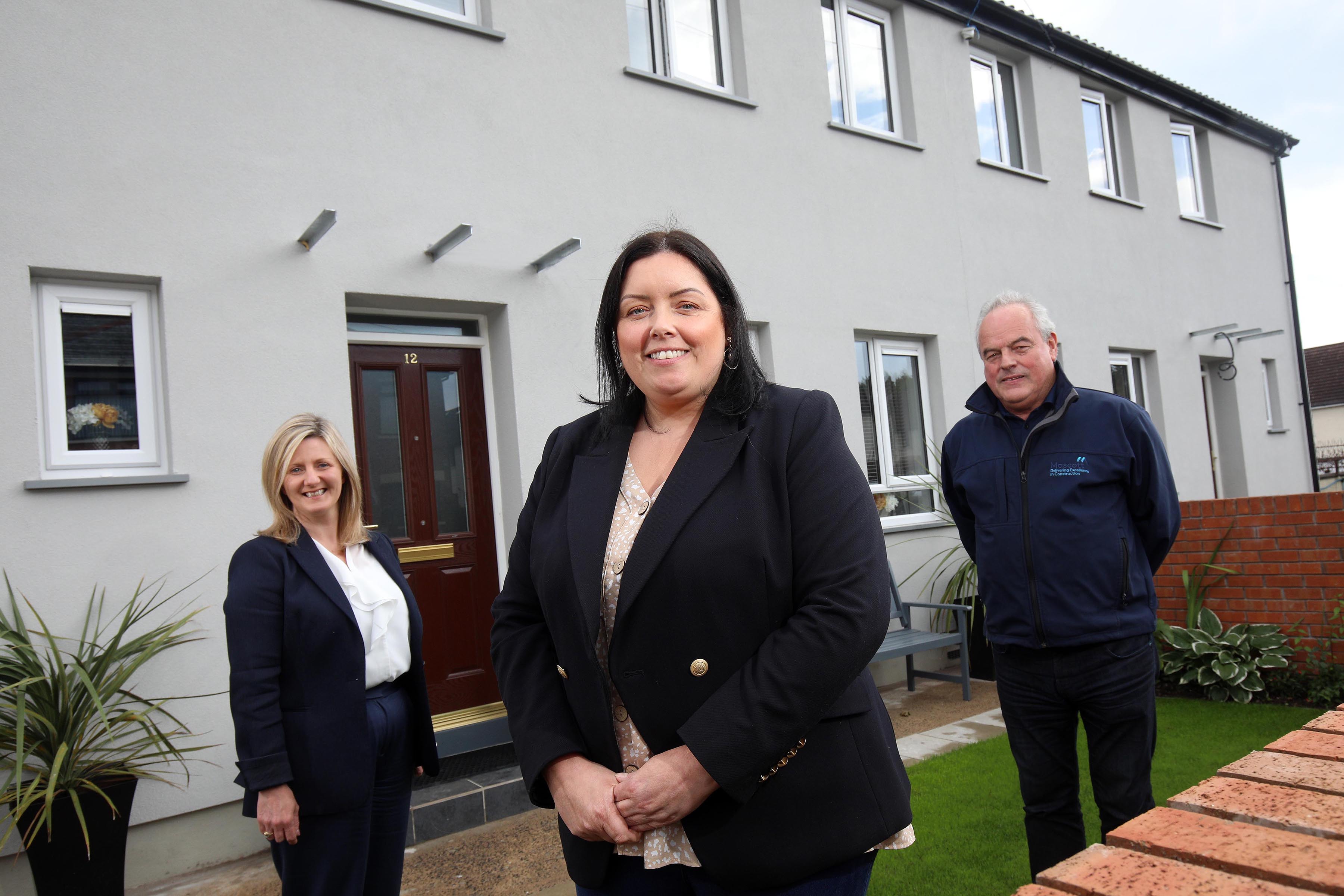 WELCOME: Communities Minister Deirdre Hargey with Grainia Long (CEO of the Housing Executive) and Gerry McEvoy of contractor M&M construction at the homes in Cliftondene Park