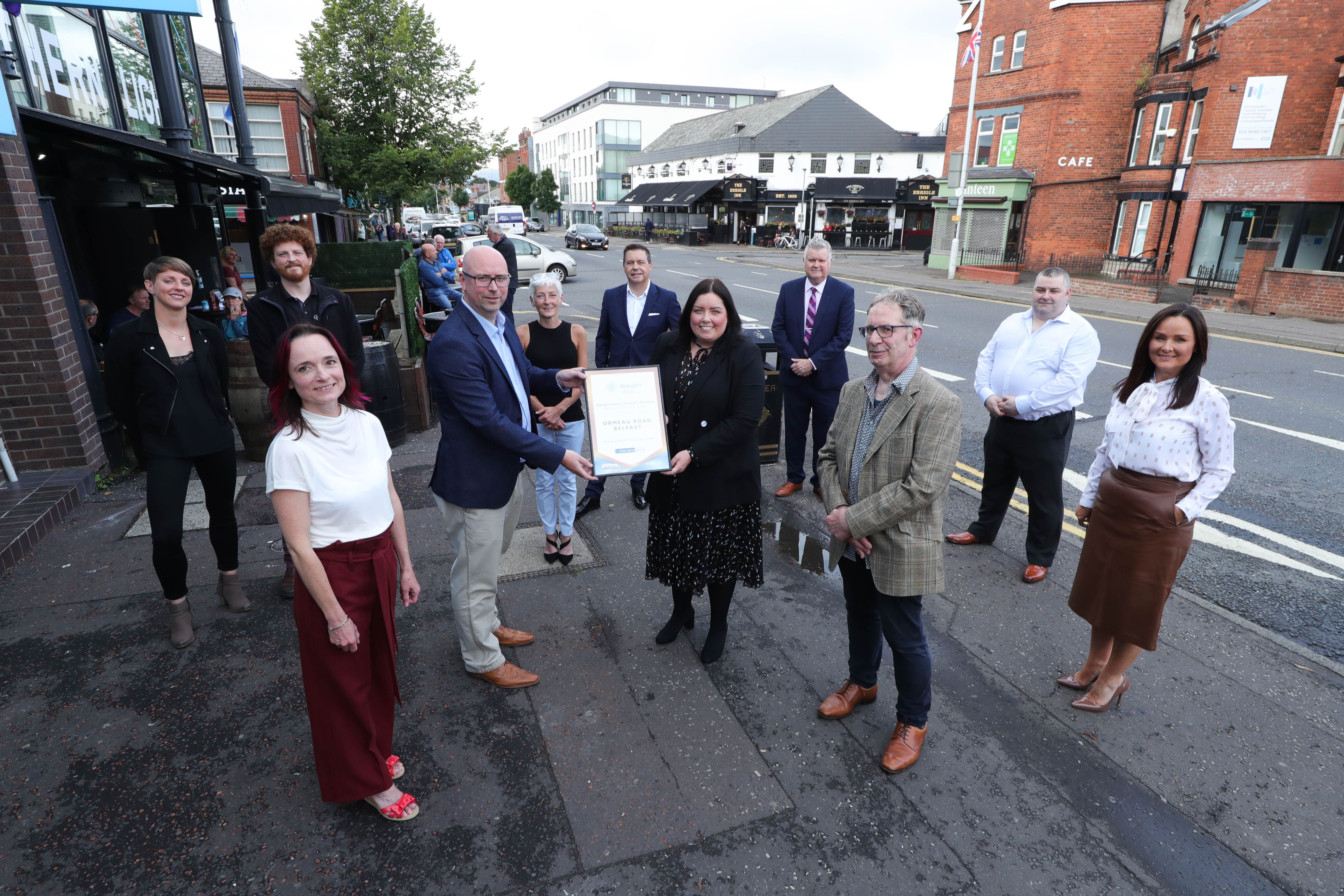 AWARD: Representatives from Ormeau Road Business Association with Glyn Roberts (Retail NI CEO) Communities Minister Deirdre Hargey MLA, Gary McDonald (Irish News Business Editor) and Aisling Press (Managing Director of Personal Banking at Danske Bank)