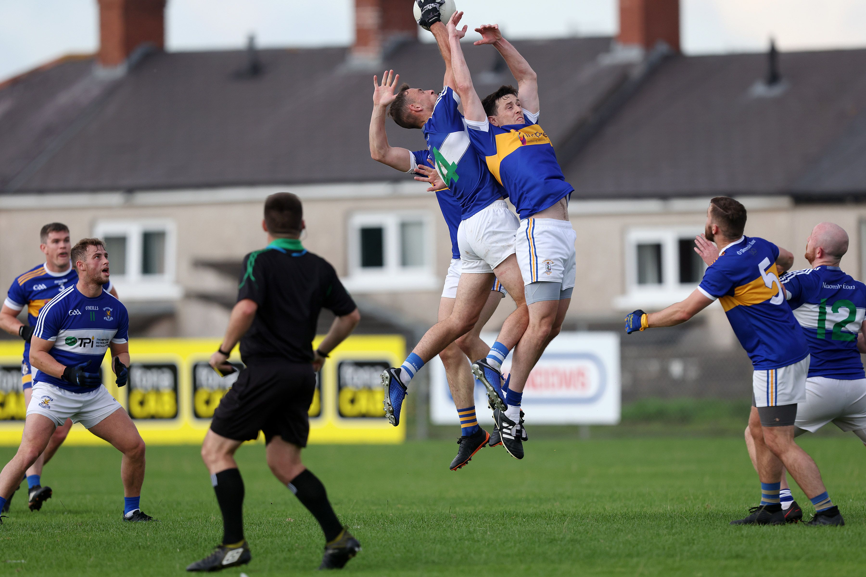 Matthew Fitzpatrick of St John\'s fights for possession with Rossa\'s Michael Armstrong during Wednesday night\'s Antrim SFC opener at Corrigan Park with the hosts winning by three points 
