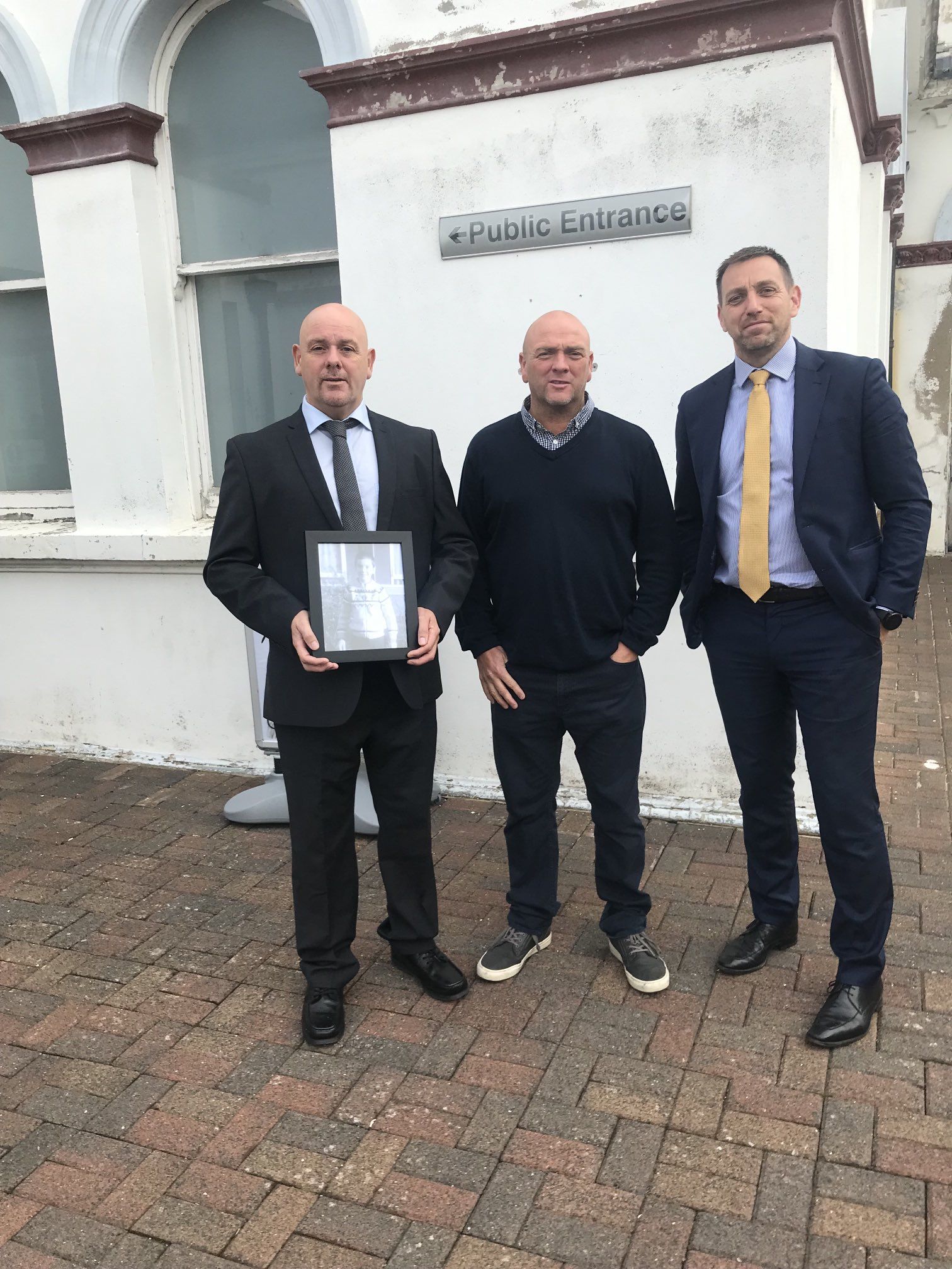 INQUEST: Stephen Geddis\' brothers, Kieran Geddis and Joe Geddis, alongside their solicitor Padráig Ó Muirigh outside Banbridge Court on Monday