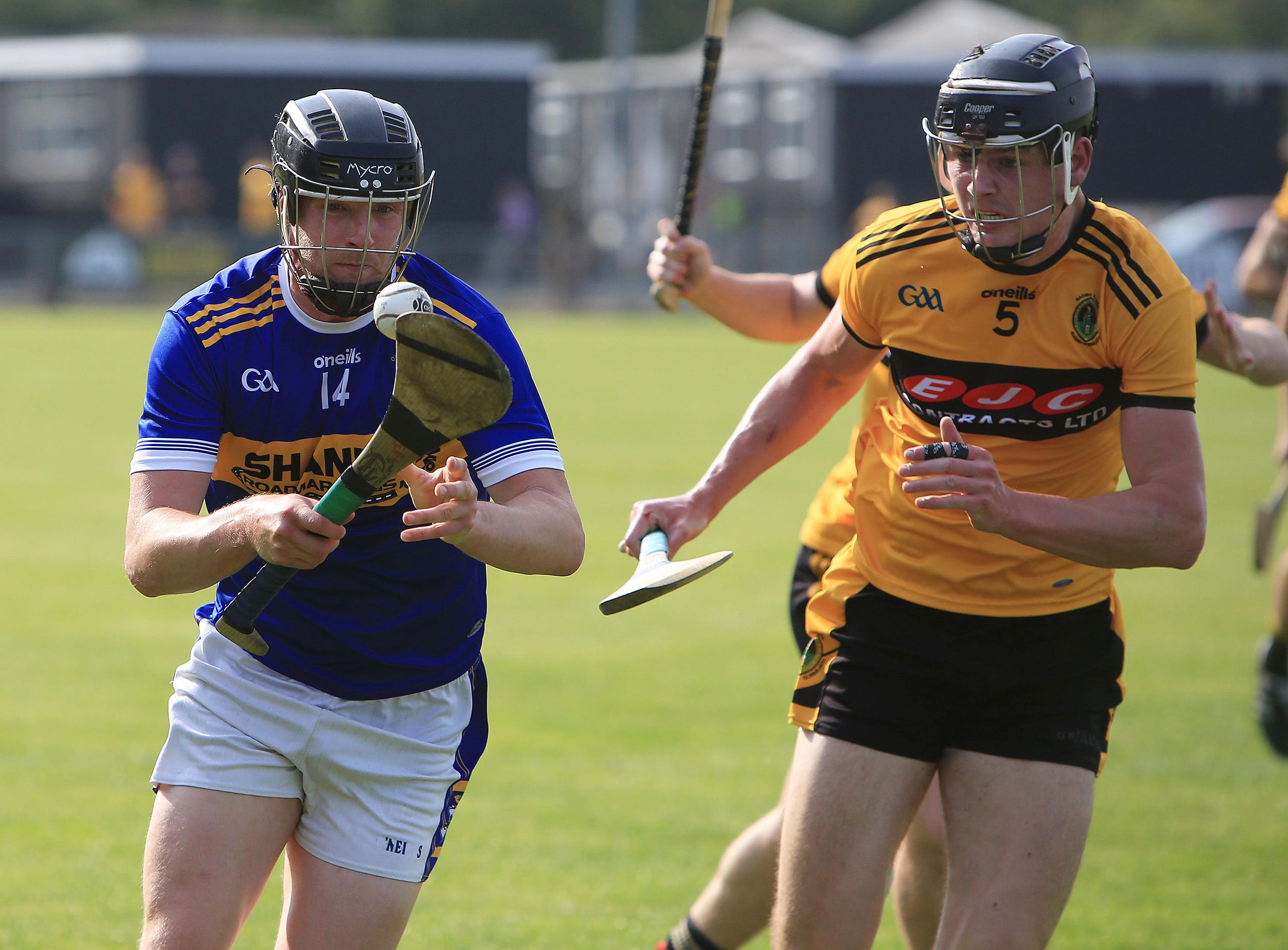 Stephen Beatty gets out in front of Joe Maskey at a sunny Hightown on Saturday