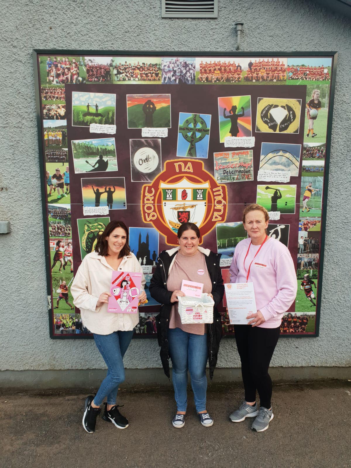 Sandra McCrea and Michelle Bradley from Gort na Móna GAC alongside Homeless Period Belfast Volunteer, Michelle McCrea