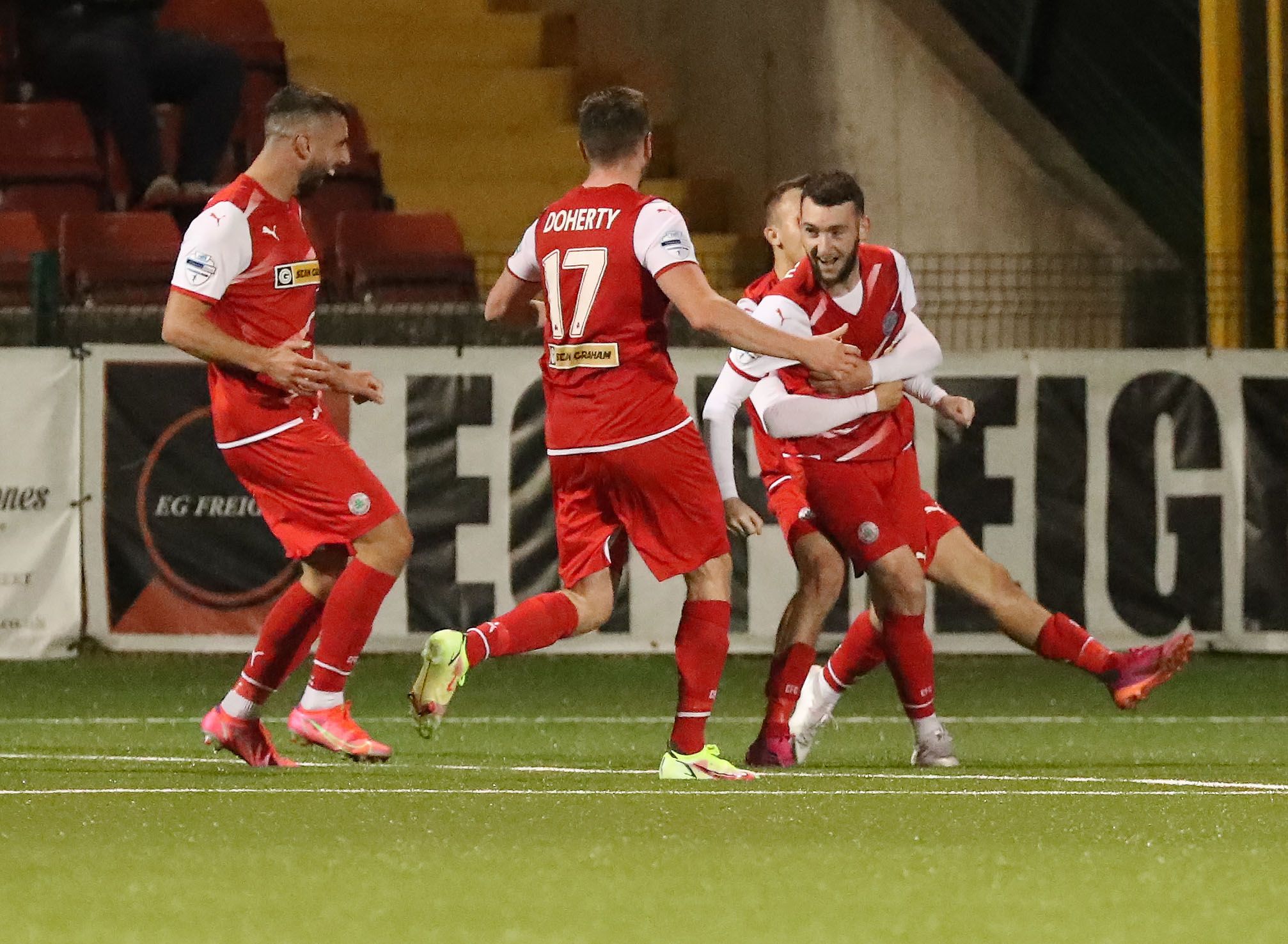 Cliftonville players celebrate finding the net at Soitude on Tuesday