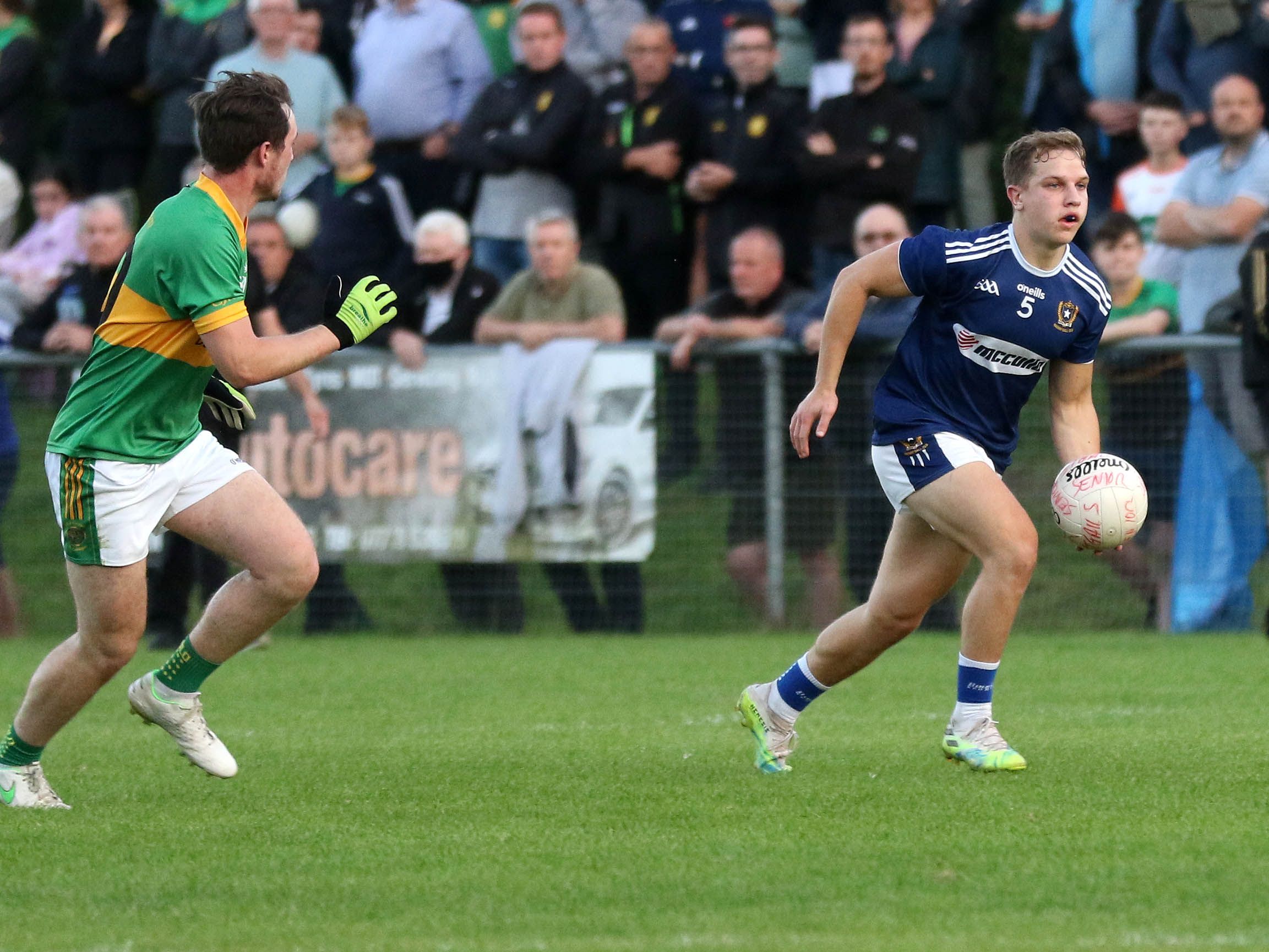 St Gall\'s defender Marcus Donnelly tried to get away from Creggan\'s Tiarnan McAteer during Wednesday night\'s Antrim SFC tie at De La Salle Park 