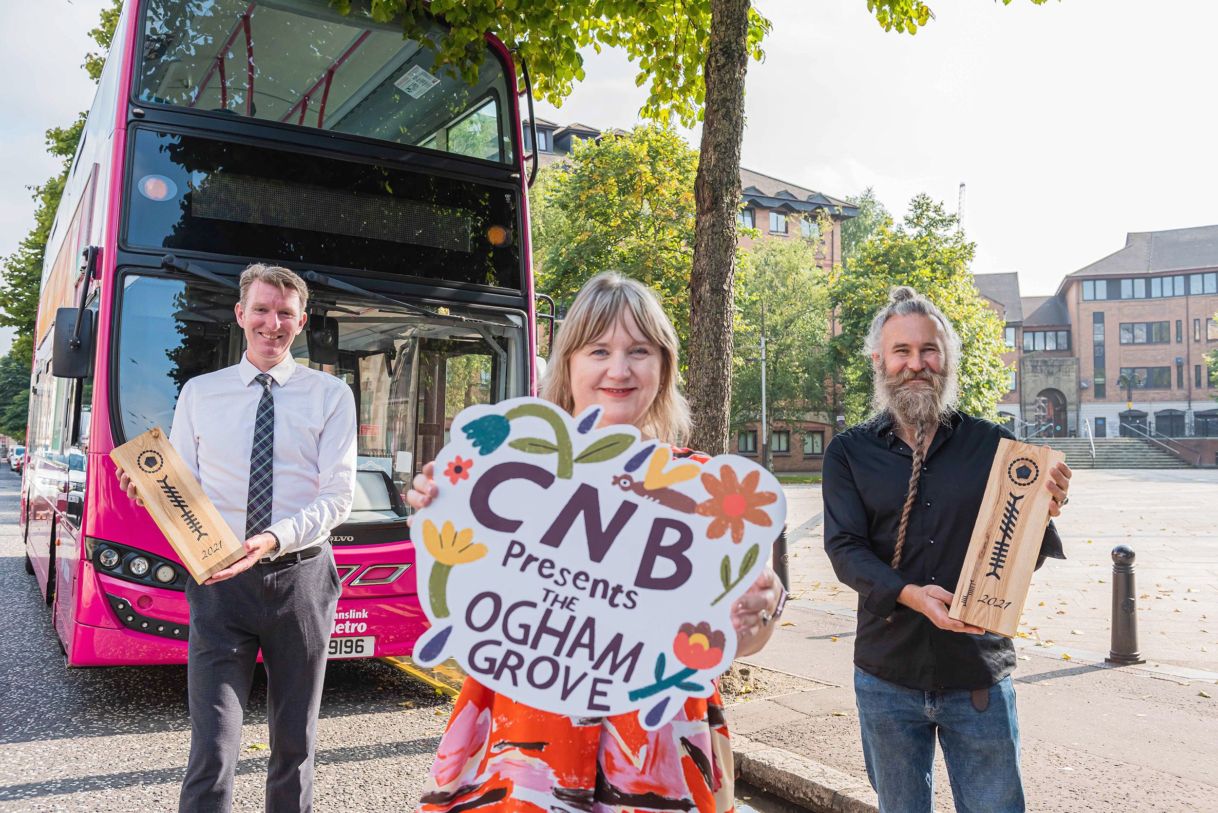 ALL ABOARD: Susan Picken, Director of Culture Night Belfast and the Cathedral Quarter Trust, is joined by Damien Bannon of Translink and artist Gawain Morrison to release the good news that Culture Night Belfast is back this year with a new format and new