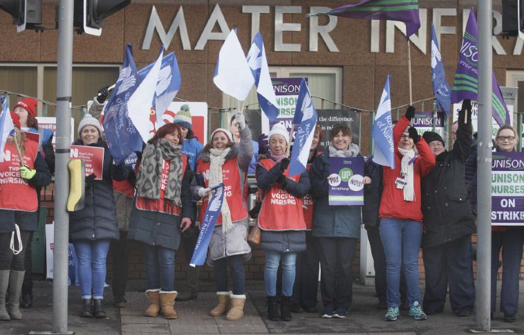 UNDERVALUED: Striking nurses is an all too common sight – and migrants face particular problems