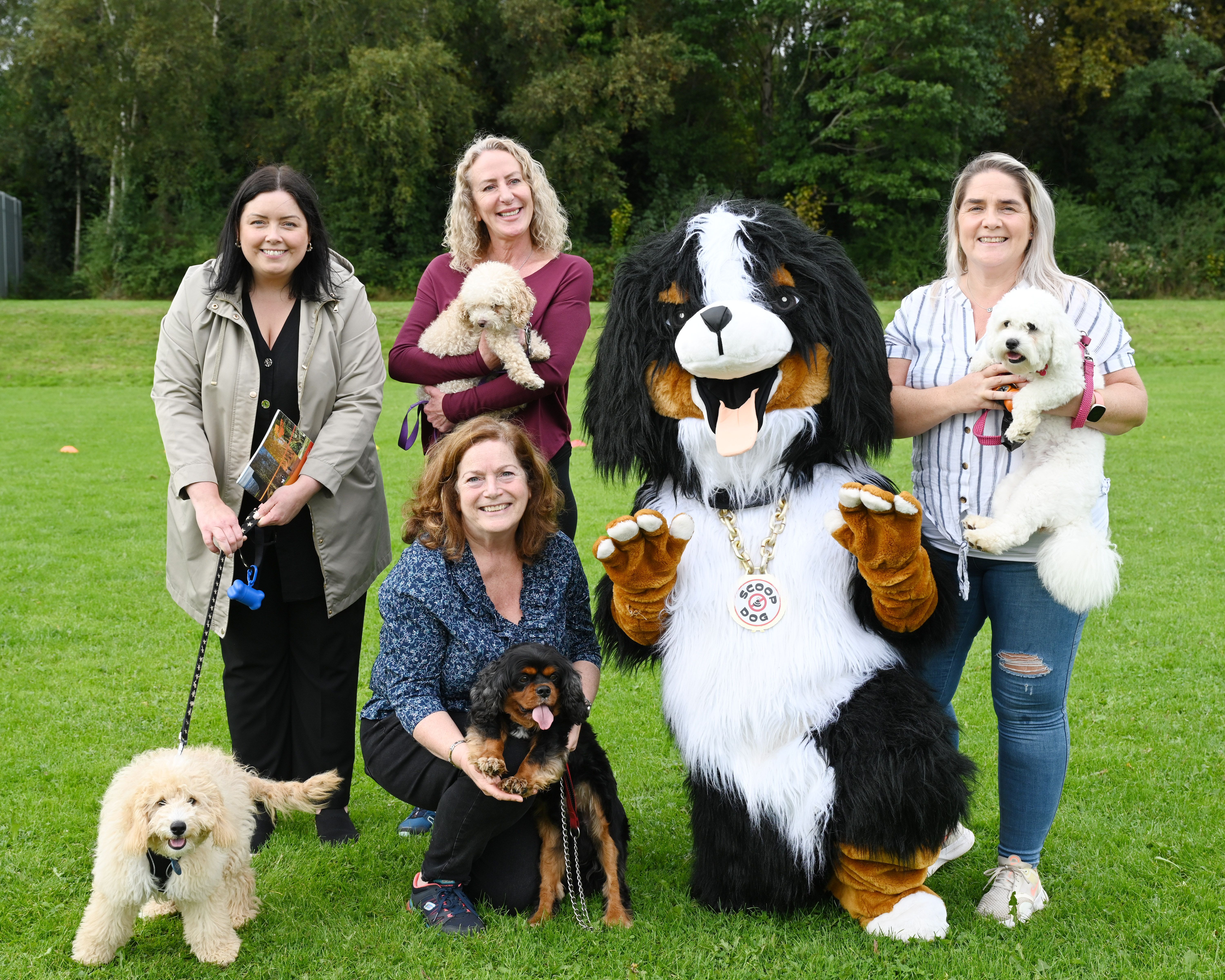 WOOF WOOF: Communities Minister Deirdre Hargey and Cllr Geraldine McAteer joined local residents and pooches at Woodlands in Finaghy