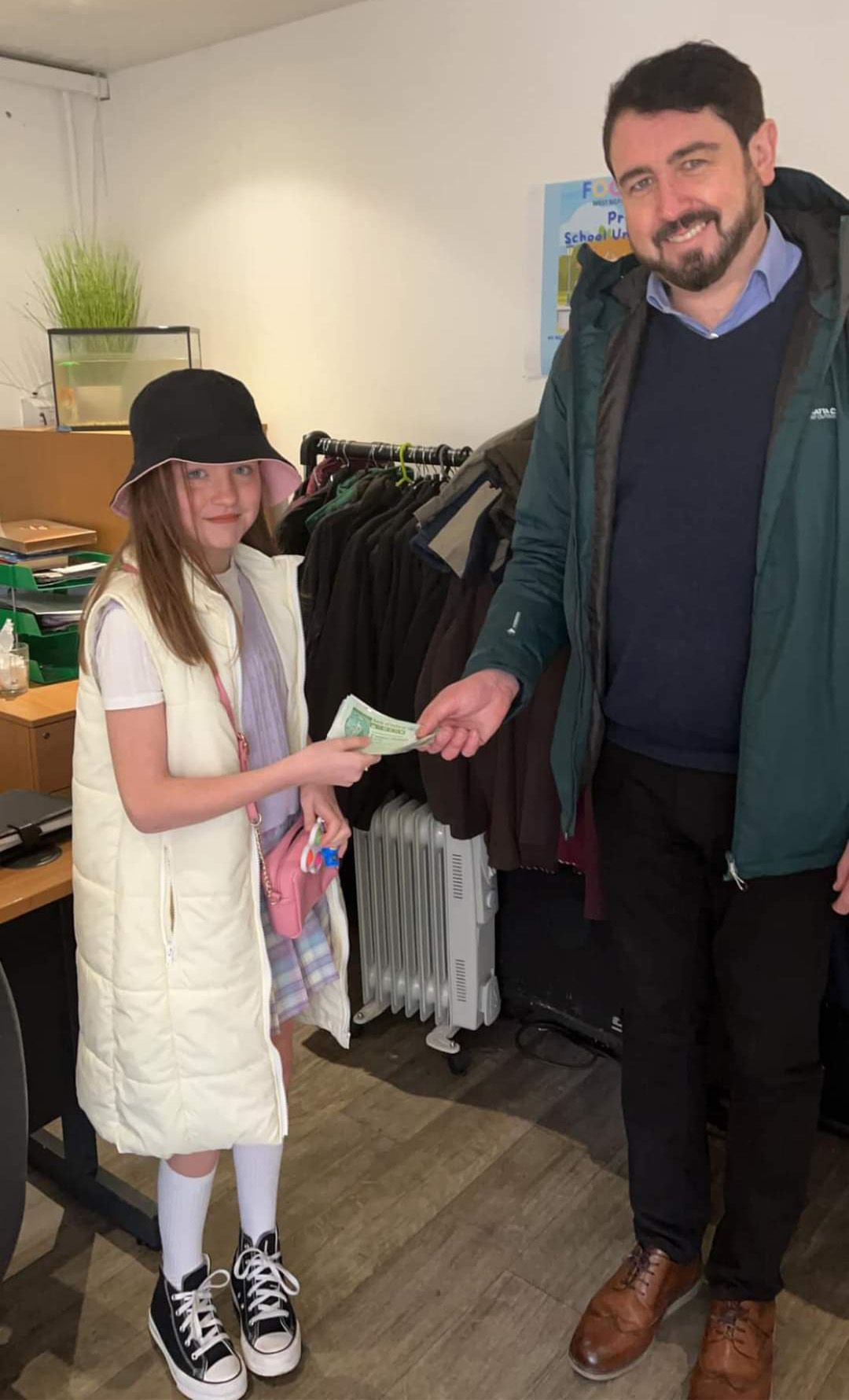 WELL DONE: Kacie Magee hands £205 to Foodstock\'s Paul Doherty