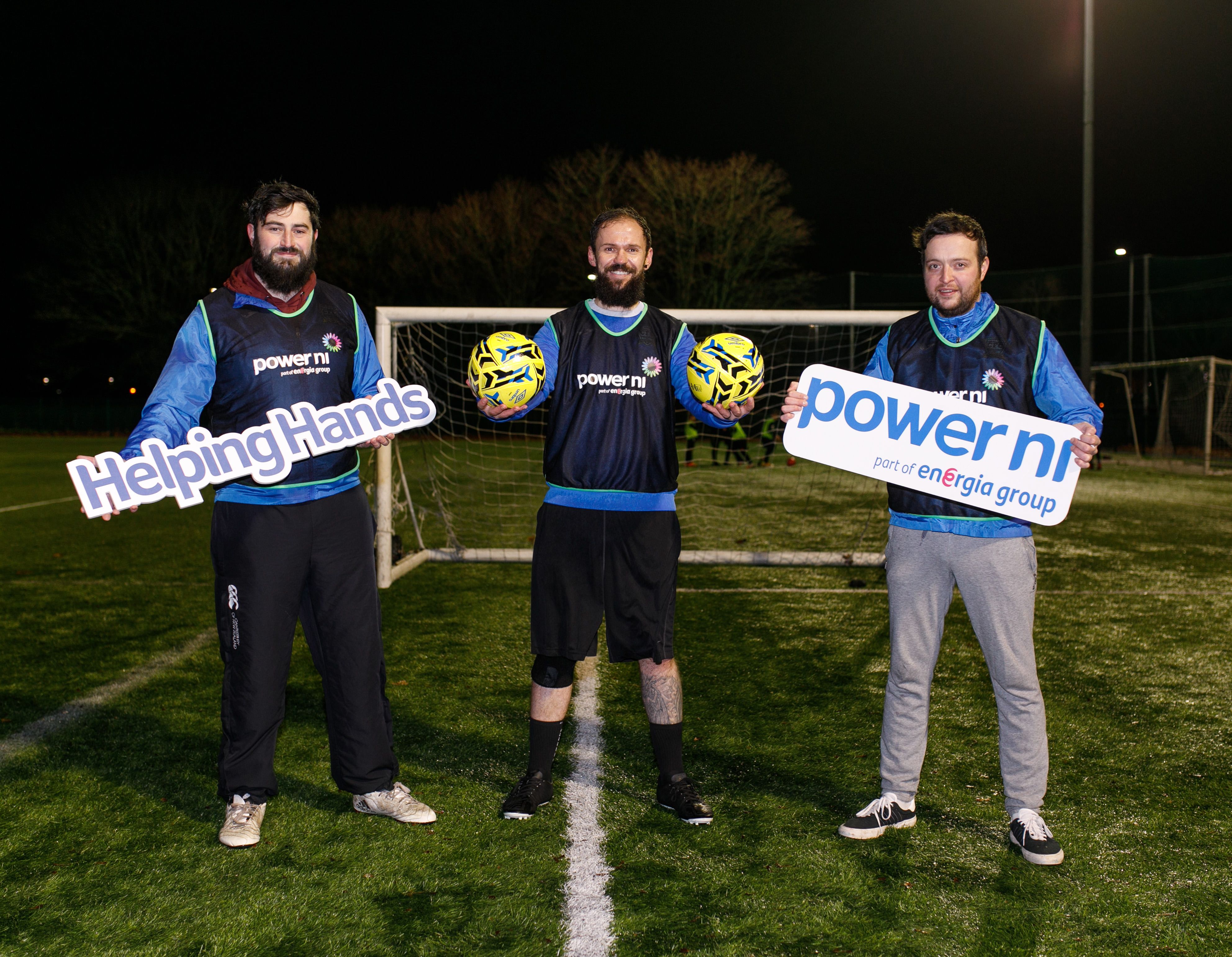 COMMUNITY: Fraser Hutcheson alongside team managers James Breen and Scott Thompson accepted the grant from PowerNI