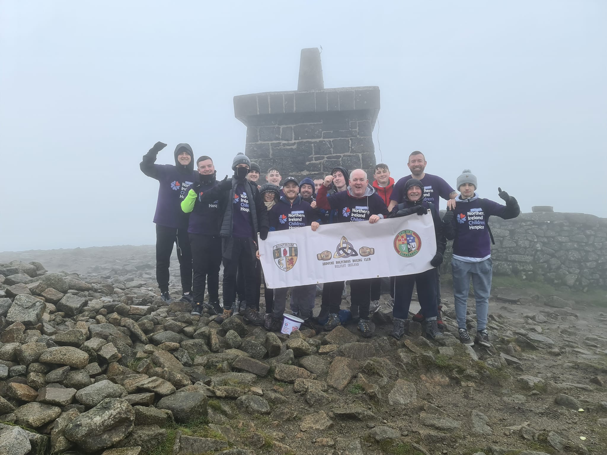 WINTER WALK: Members of Ardoyne Holy Cross Boxing Club climbed the Mourne mountains in aid of the Children\'s Hospice.