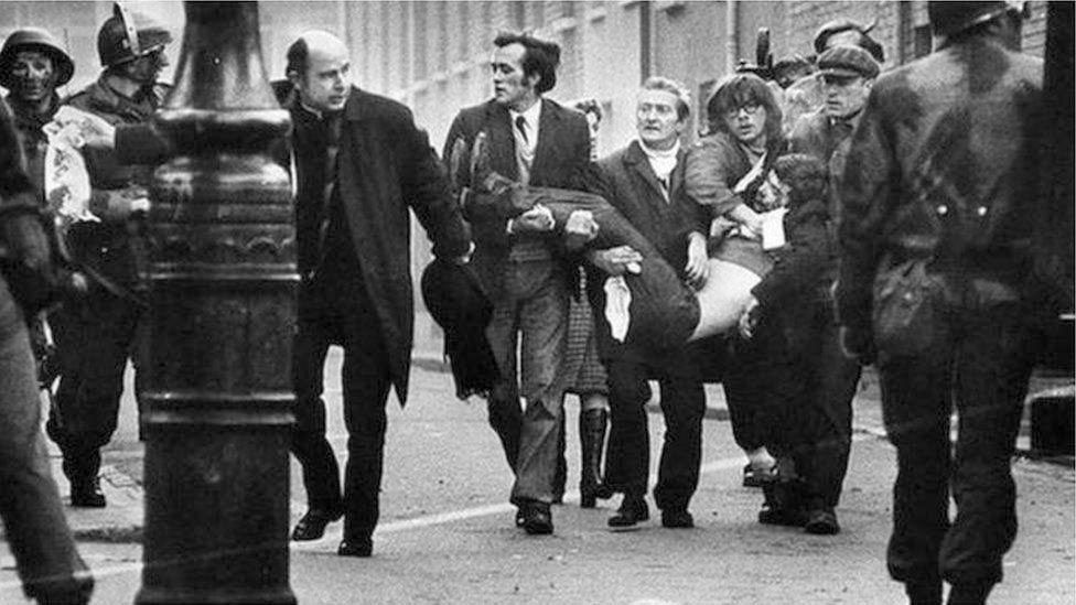 BLOODY SUNDAY: Fr Edward Daly waves a handkerchief stained with the blood of Jackie Duddy (17)