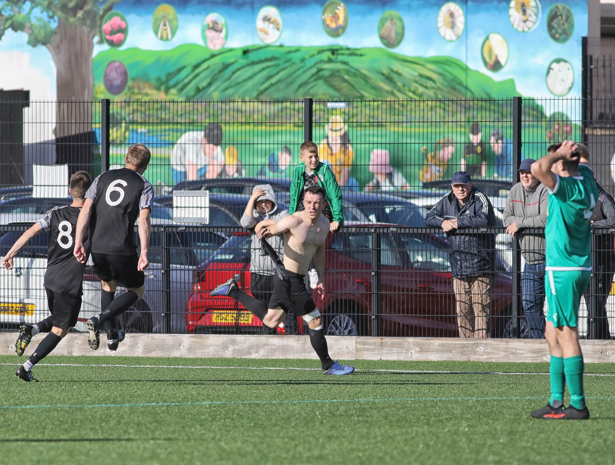 James Haughey wheels away after netting Immaculata\'s second at Cliftonville Playing Fields on Saturday 