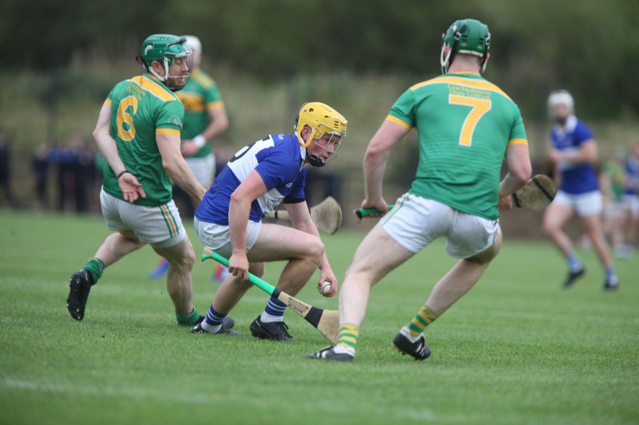 Oisin MacManus tries to escape the attention of Kevin Molloy and Eamon Smyth