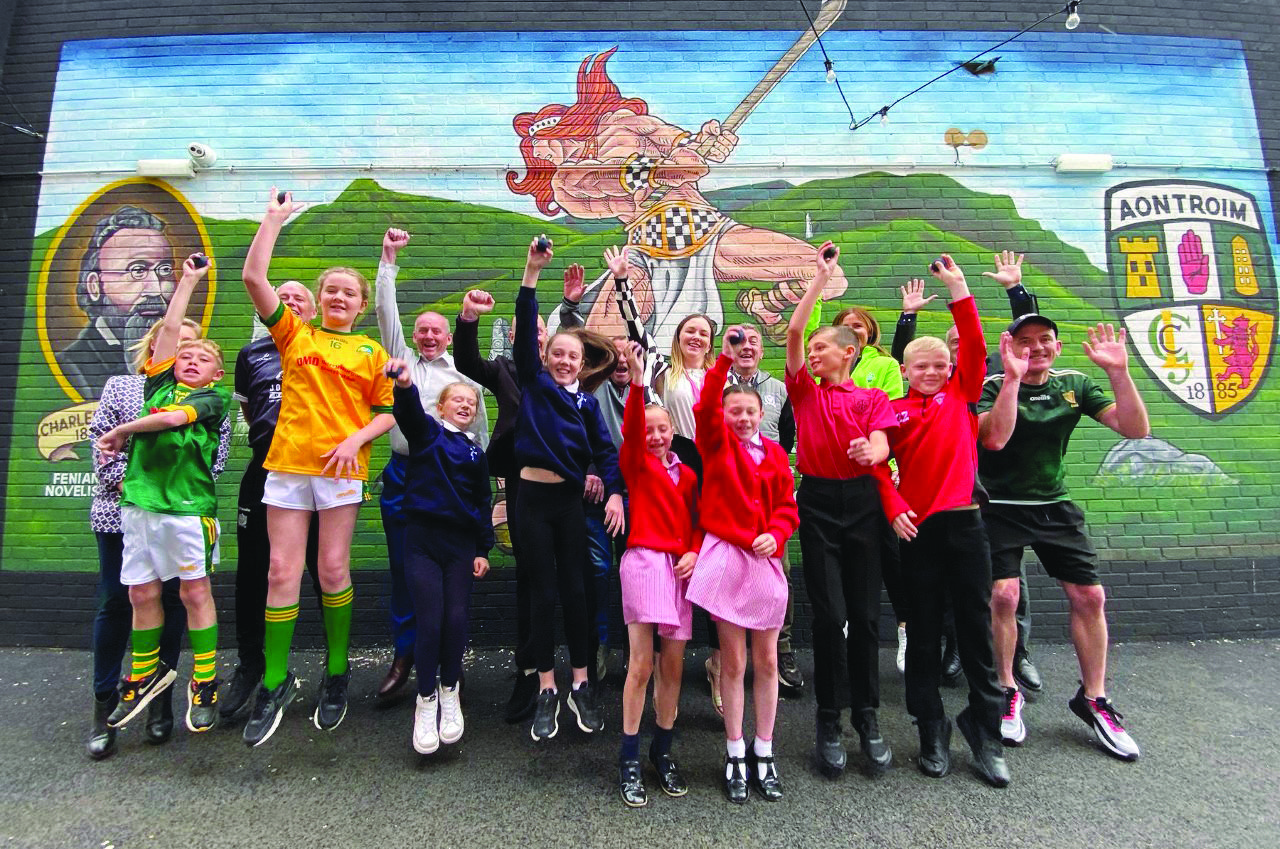 Ardoyne Kickham’s members celebrate the reopening of the club’s handball court