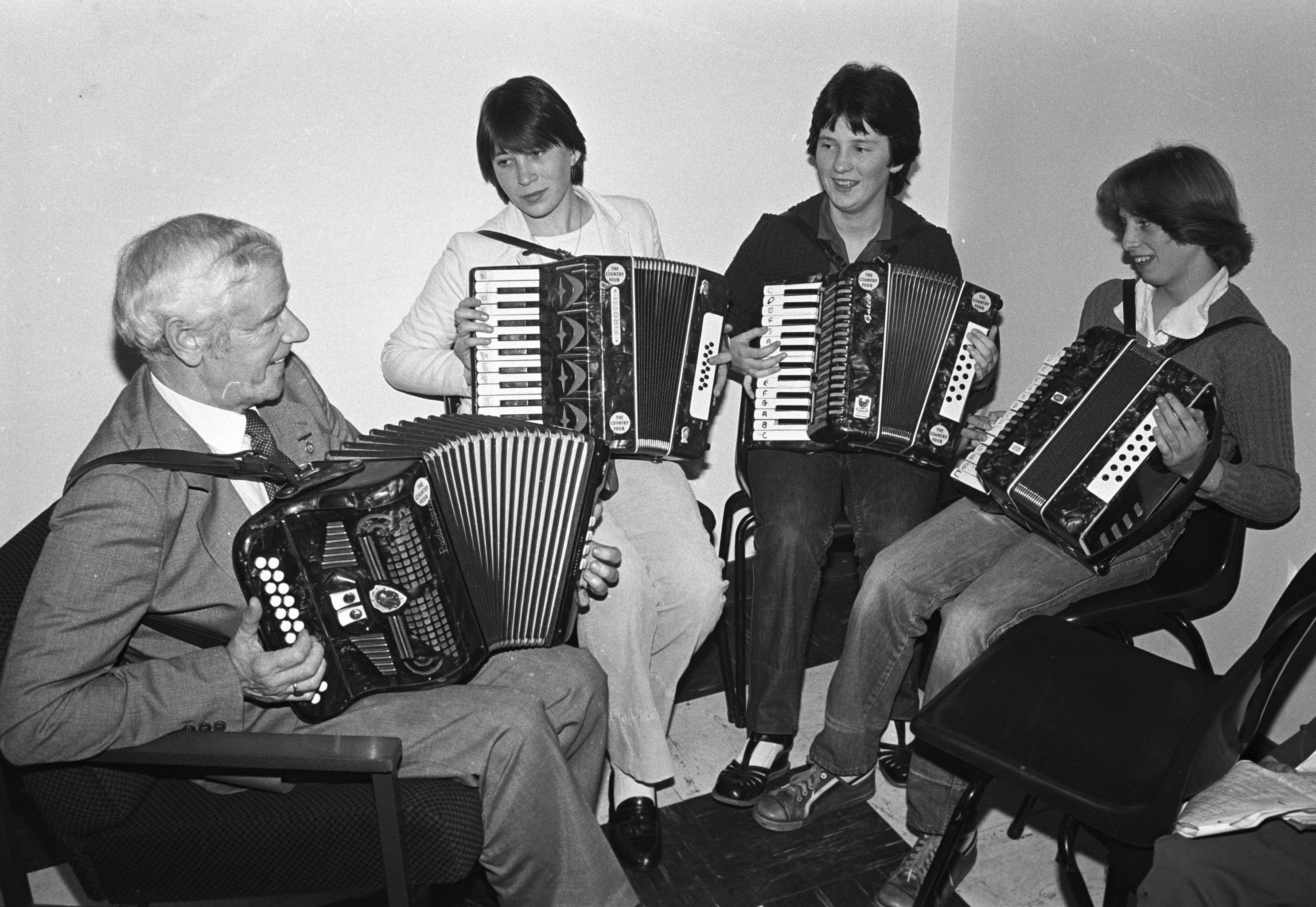 Joe McCullough with Kathy Lyttle, Mairead McCoey and Caroline Canavan of the St Patrick\'s Accordion Band back in October 1980