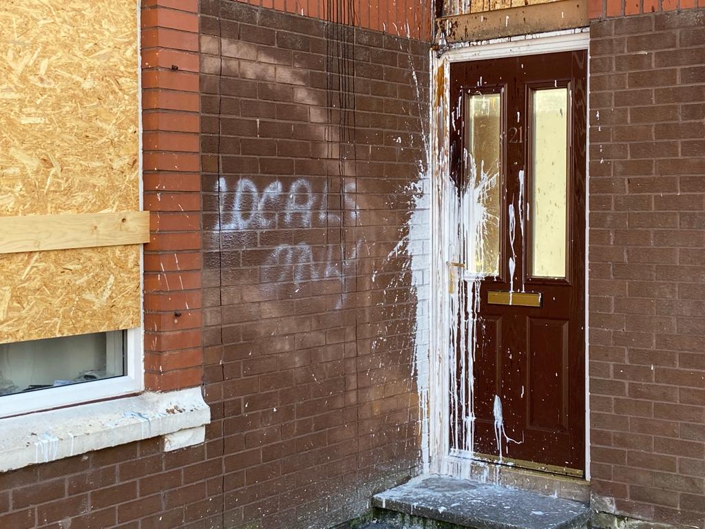 HATE CRIME: Windows were broken in a previous attack and racist graffiti daubed on the property