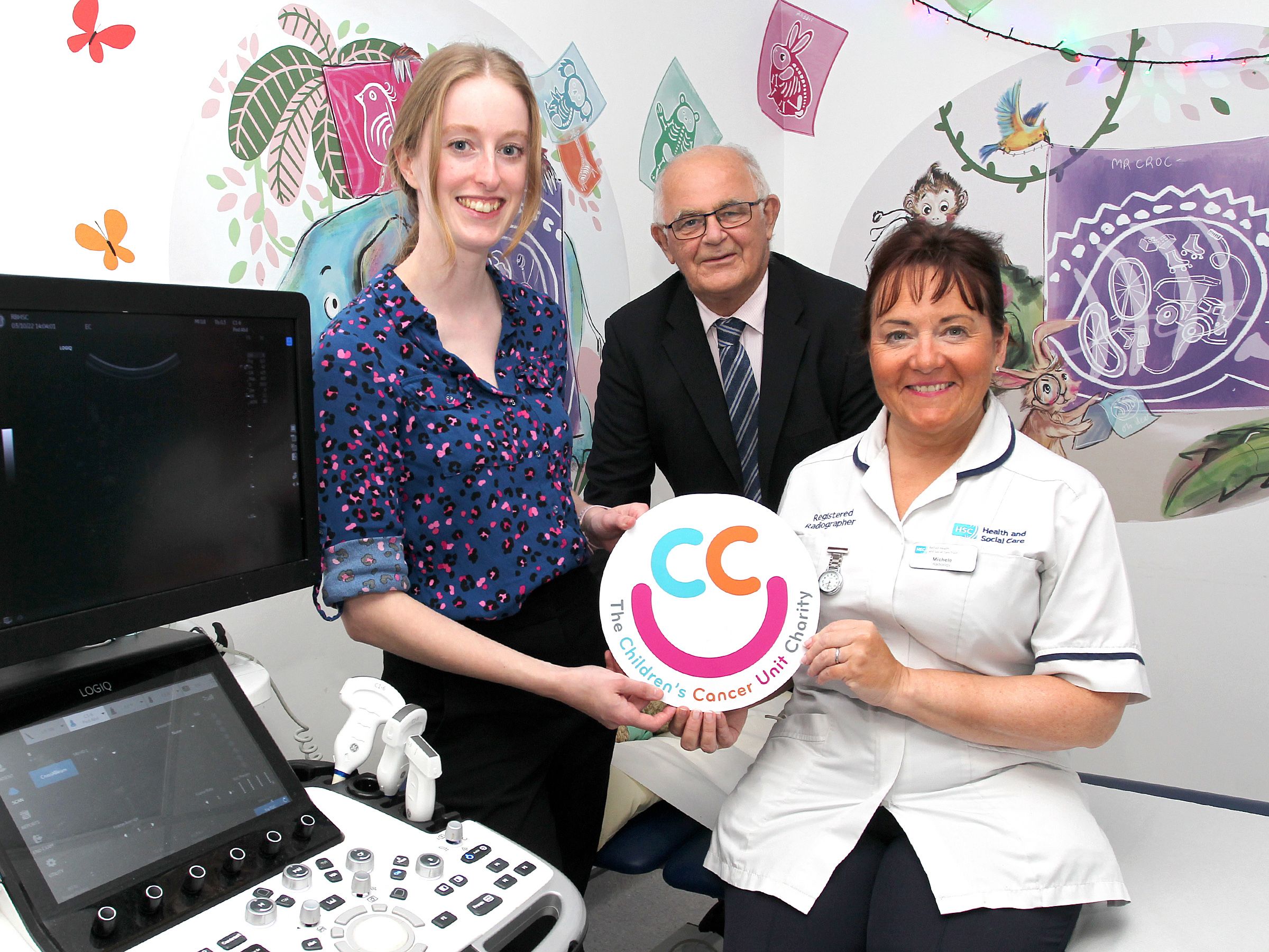 BOOST: Niabh Kirk (Imaging Lead) celebrates the opening of a new ultrasound room at Royal Belfast Hospital for Sick Children with Felix Mooney (Chairman of Children’s Cancer Unit Charity) and Michelle Mooney (Senior Radiographer)