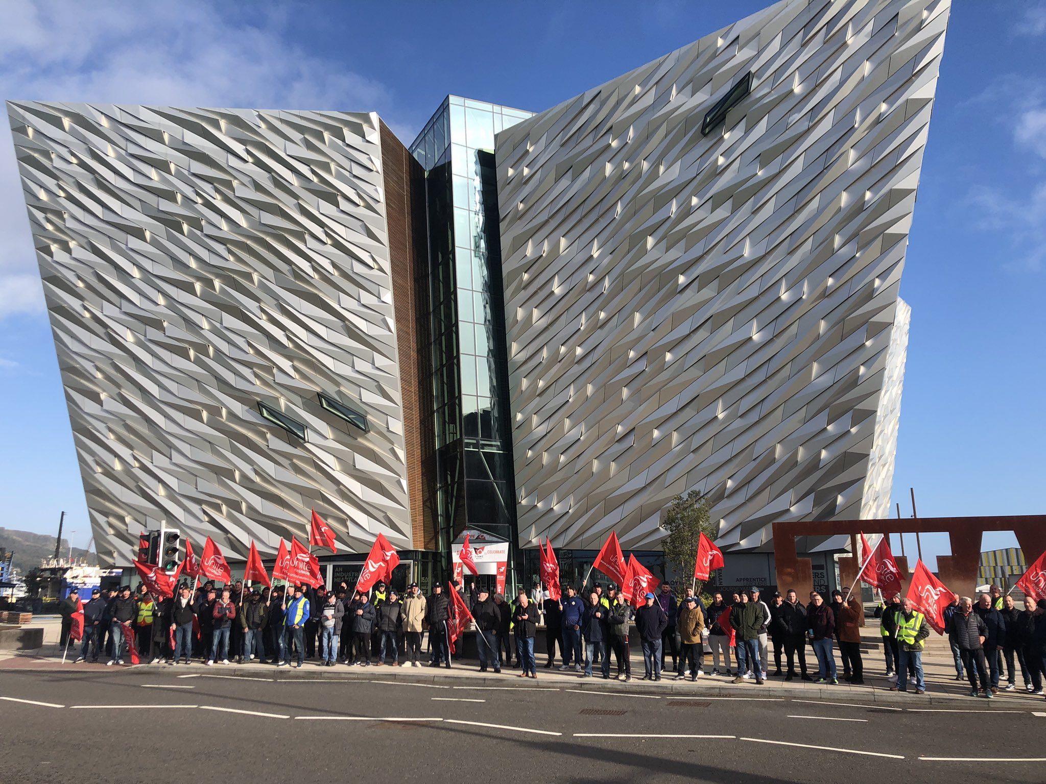 Unite Housing Executive workers protest outside Titanic Centre.